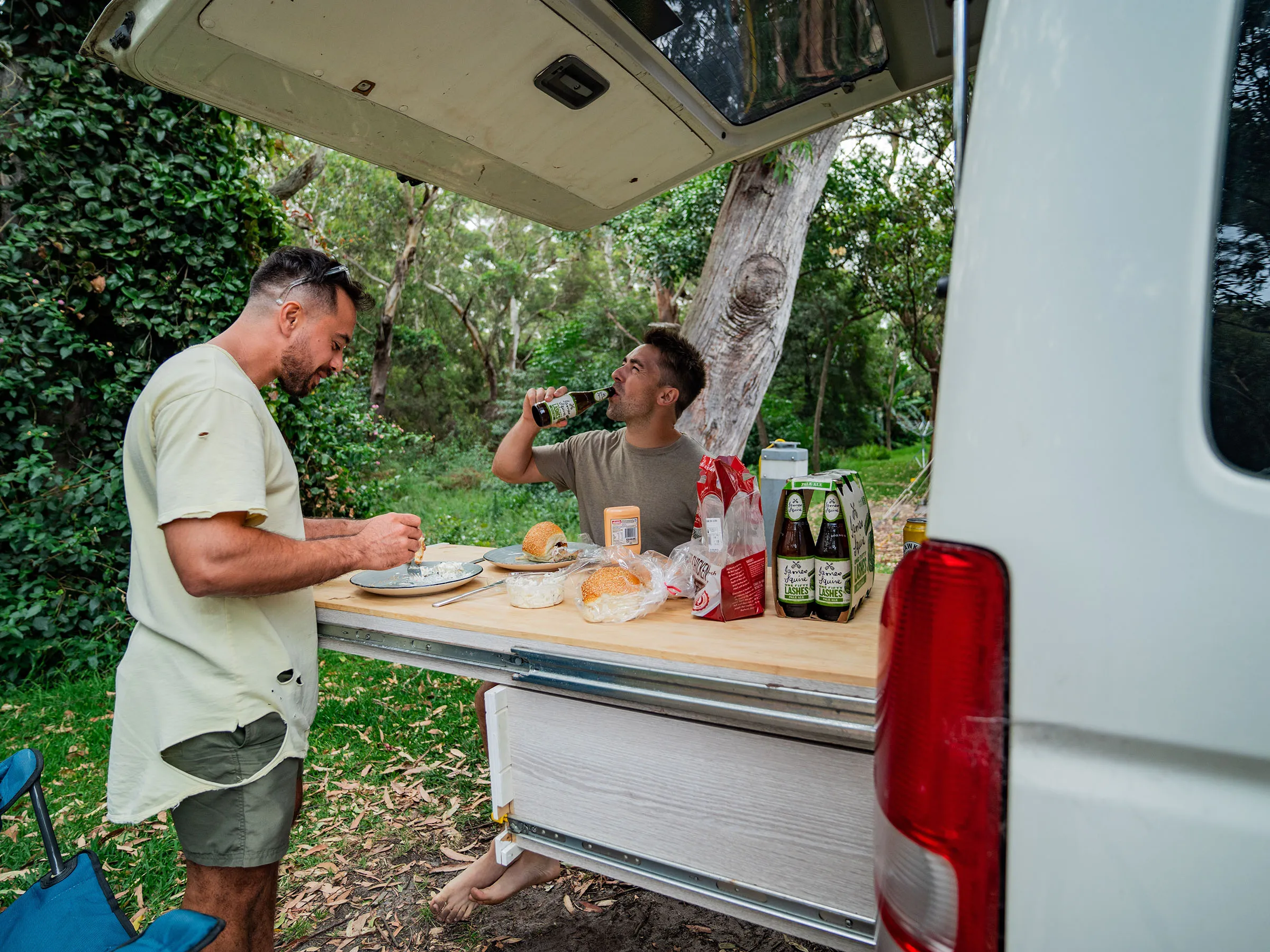 Reflections Holidays Jimmys Beach holiday & caravan park two men eating breakfast and vanlifing