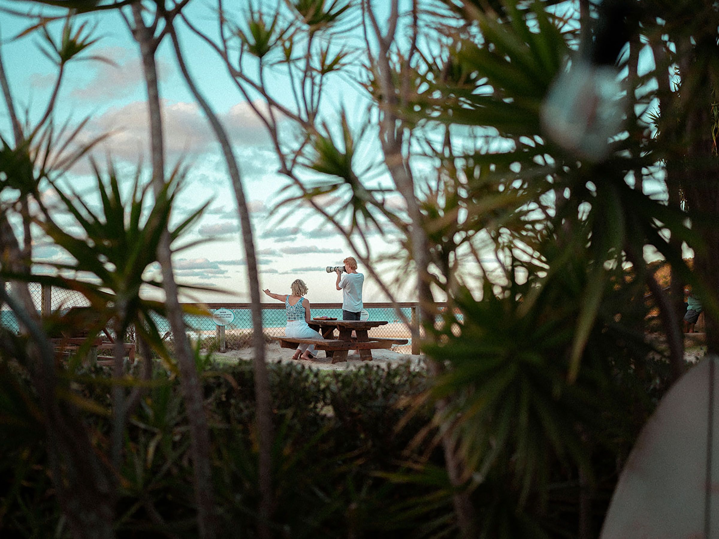 people looking over beach front view at Clarkes Beach Byron Bay