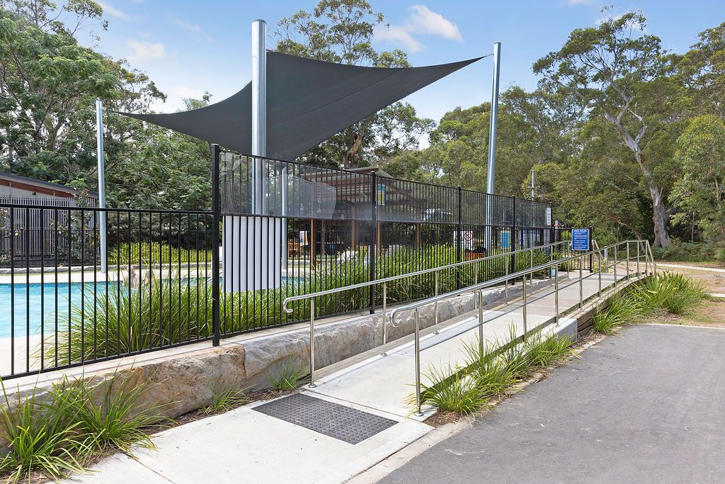 Shaded swimming pool with ramp access at Reflections Jimmys Beach Caravan Park
