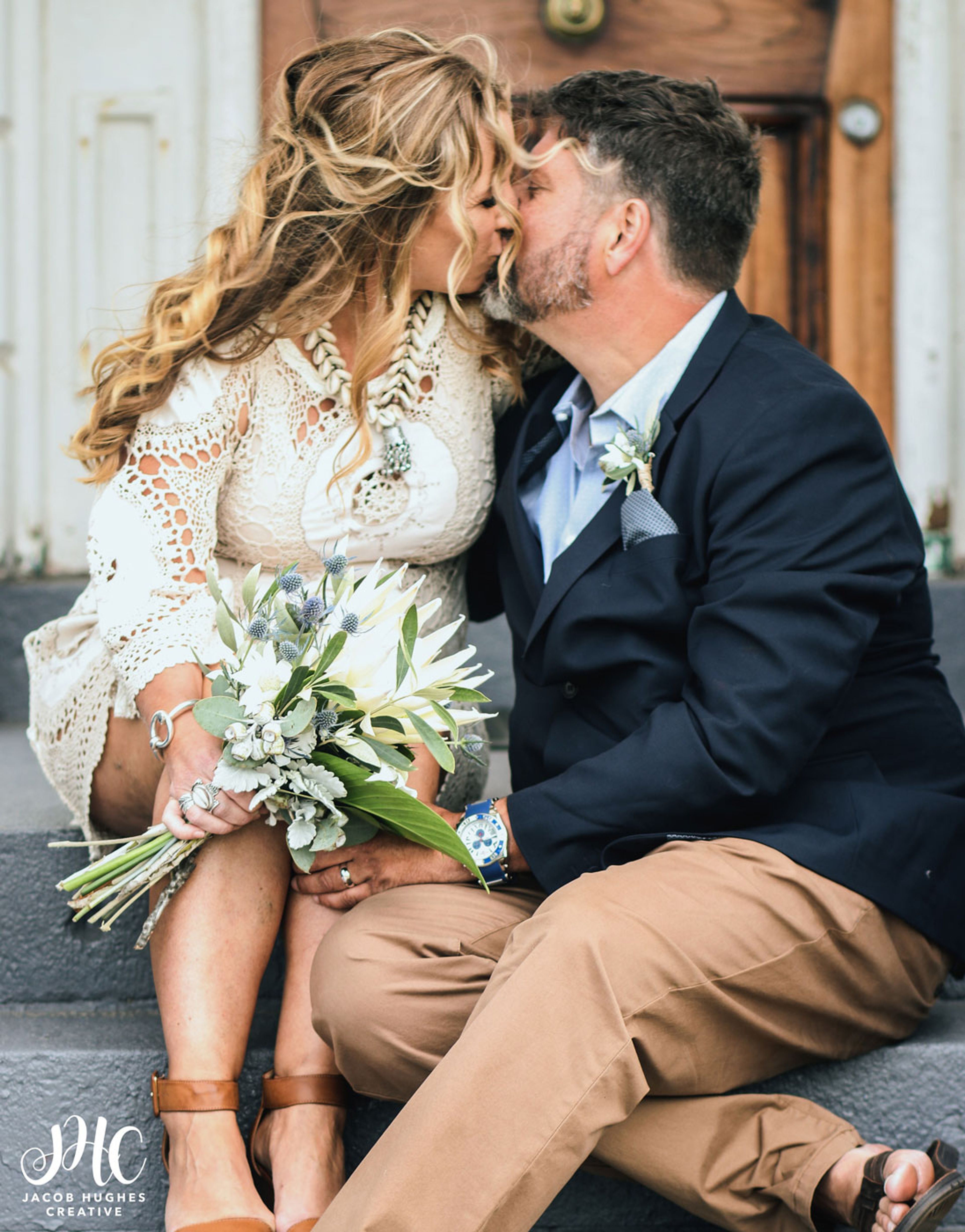 norah head lighthouse weddings bride and groom kissing on lighthouse steps 