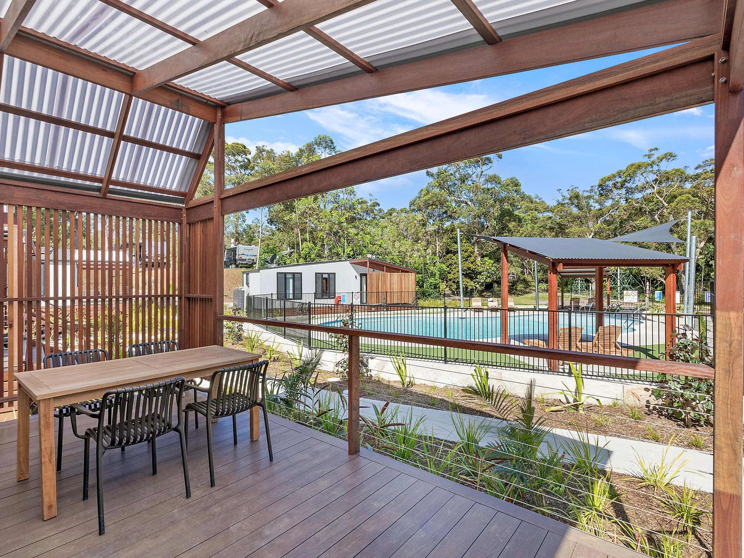 Reflections Holidays Jimmys Beach holiday & caravan park cabin veranda overlooking swimming pool