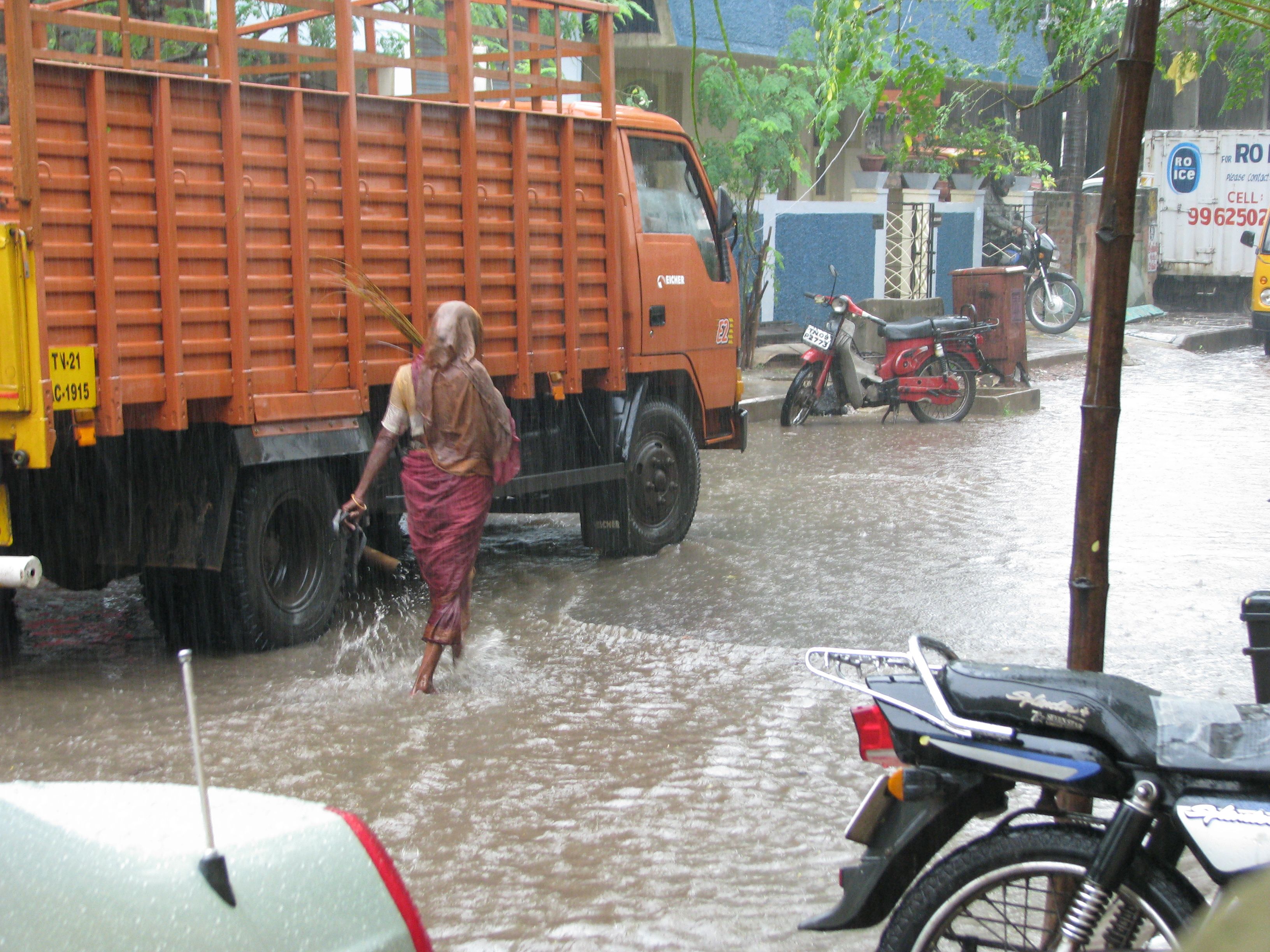 Heavy monsoon rains and waterlogged street during IMD weather alert