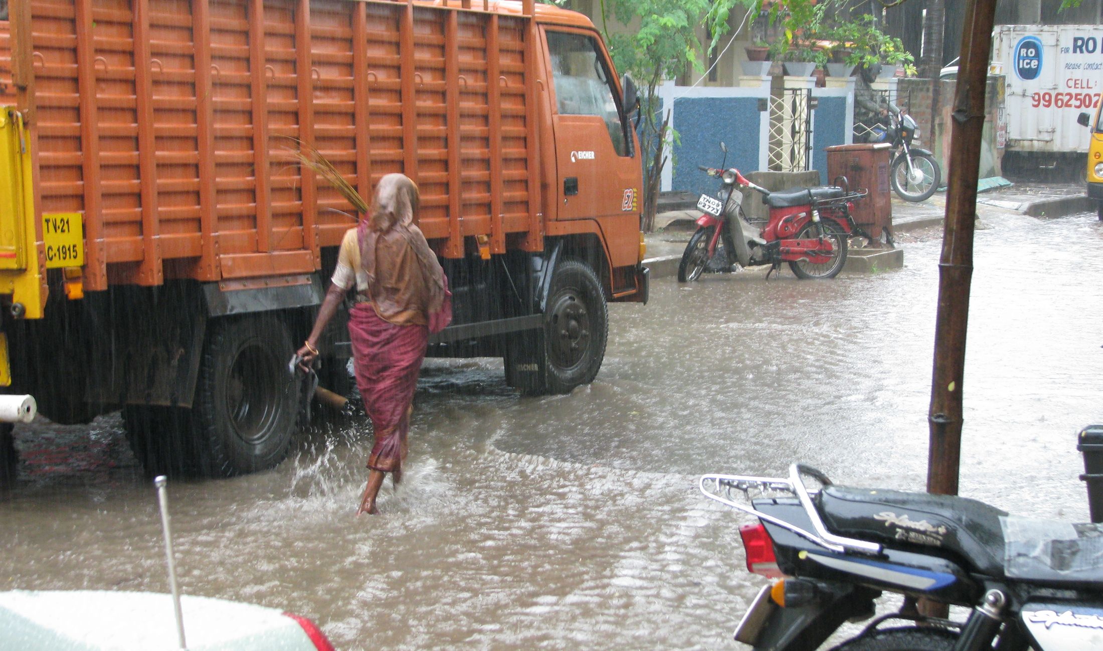 Heavy monsoon rains and waterlogged street during IMD weather alert