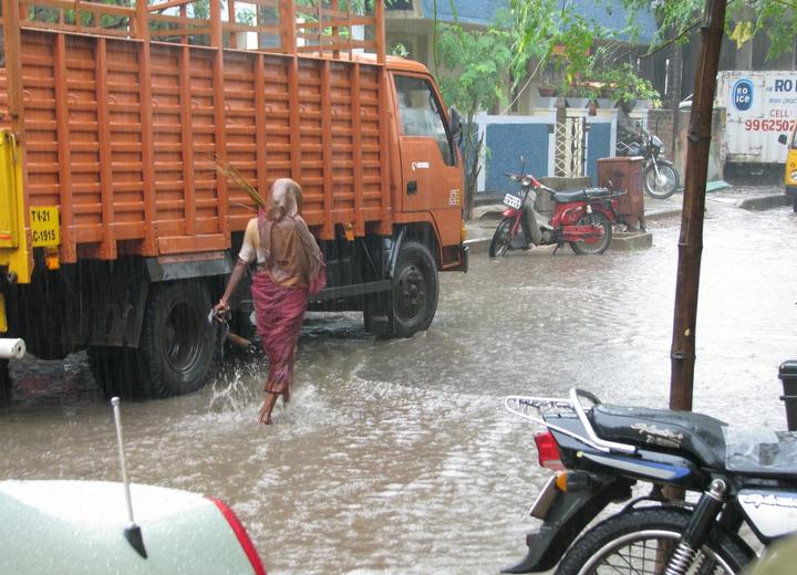 Heavy monsoon rains and waterlogged street during IMD weather alert