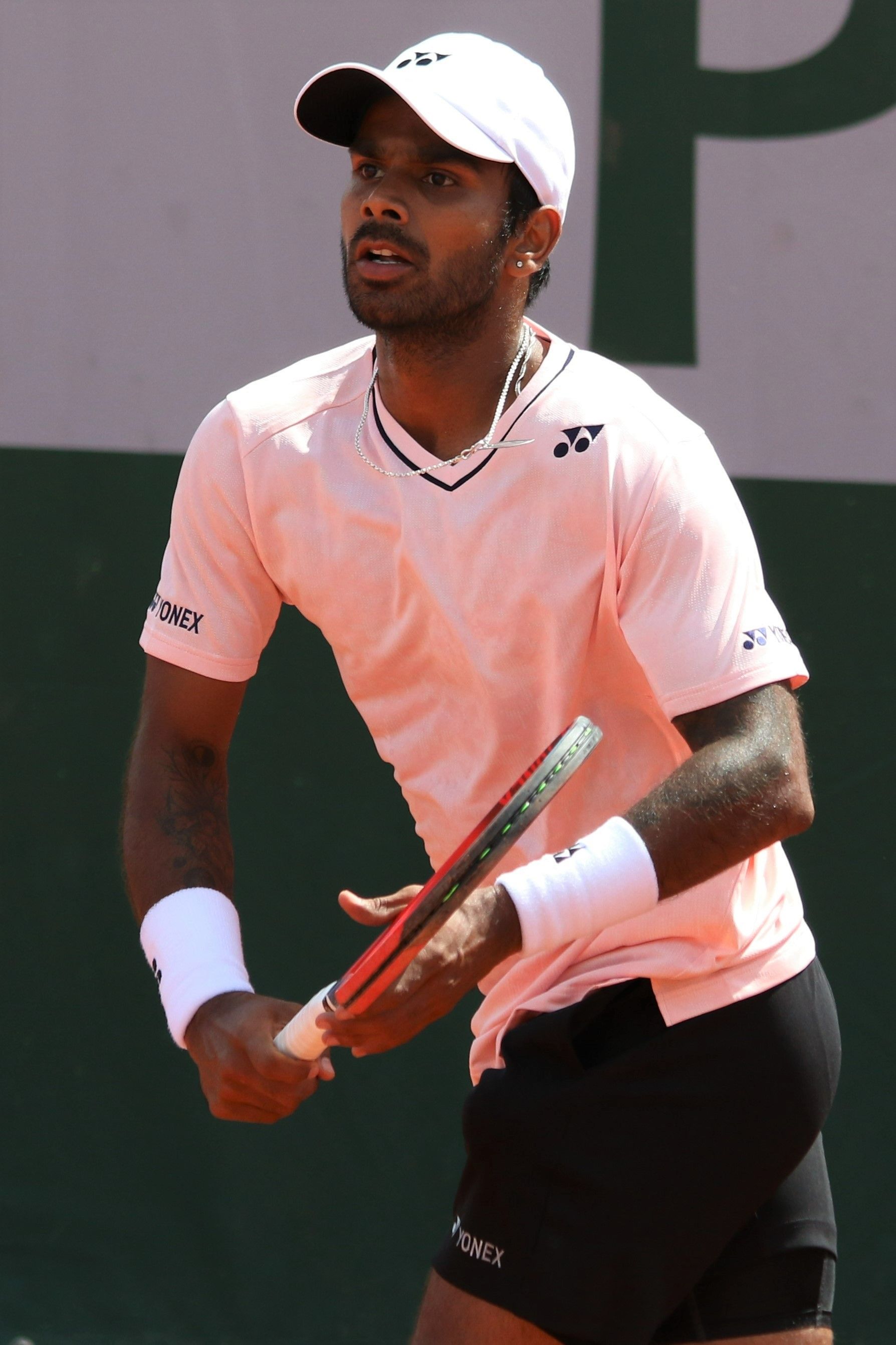 Sumit Nagal serving in professional tennis match