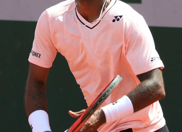 Sumit Nagal serving in professional tennis match