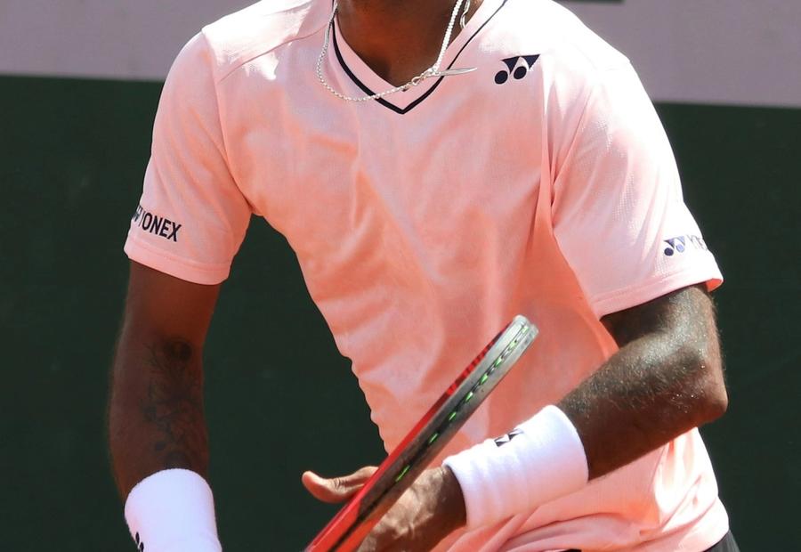 Sumit Nagal serving in professional tennis match