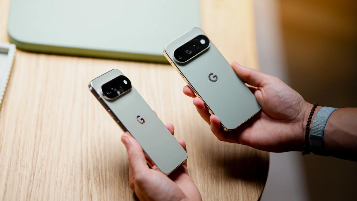 Two Google Pixel 11 Pro smartphones held in hand, showing their rear camera bars and design.