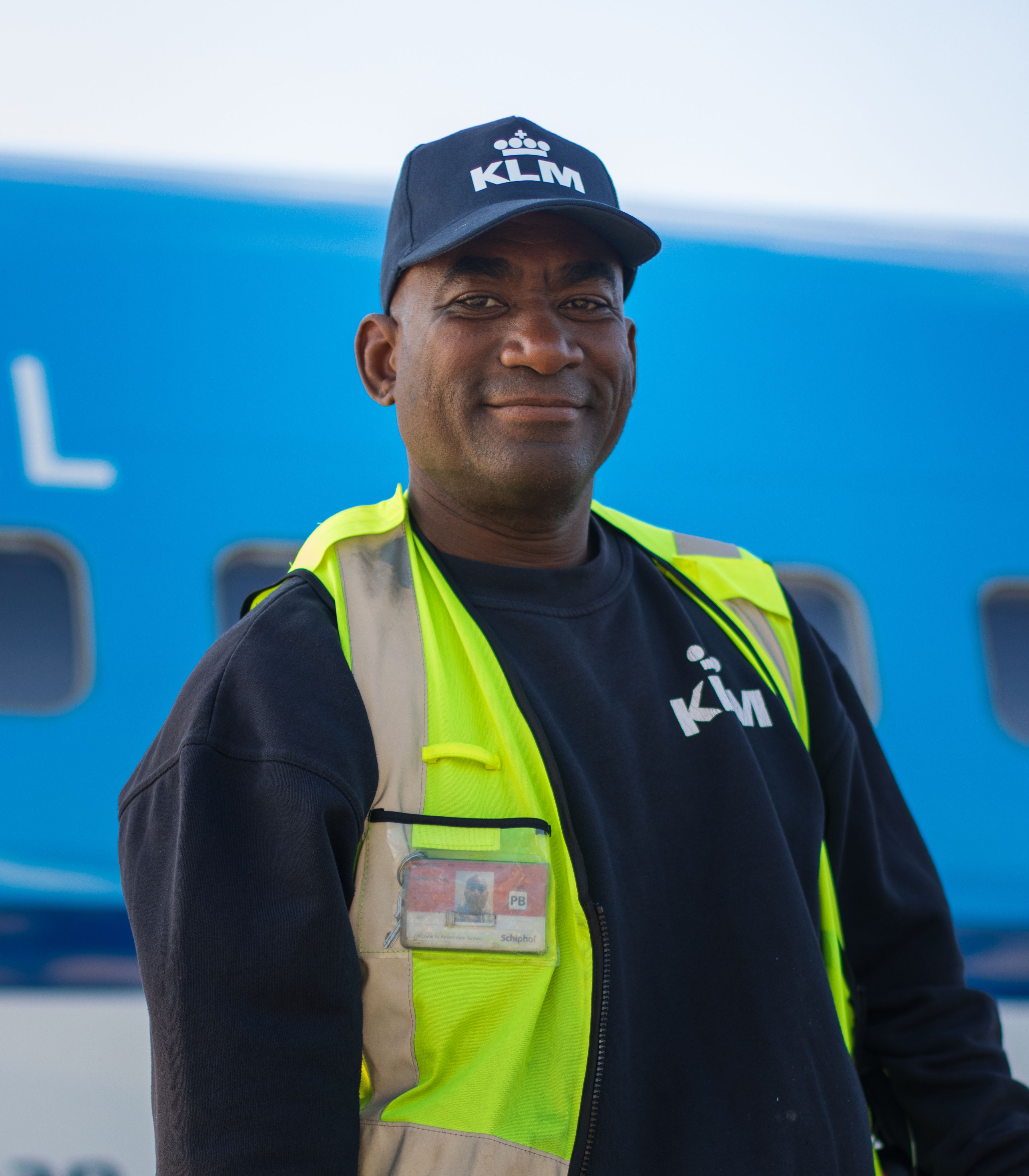 Ground staff member posing in front of boeing