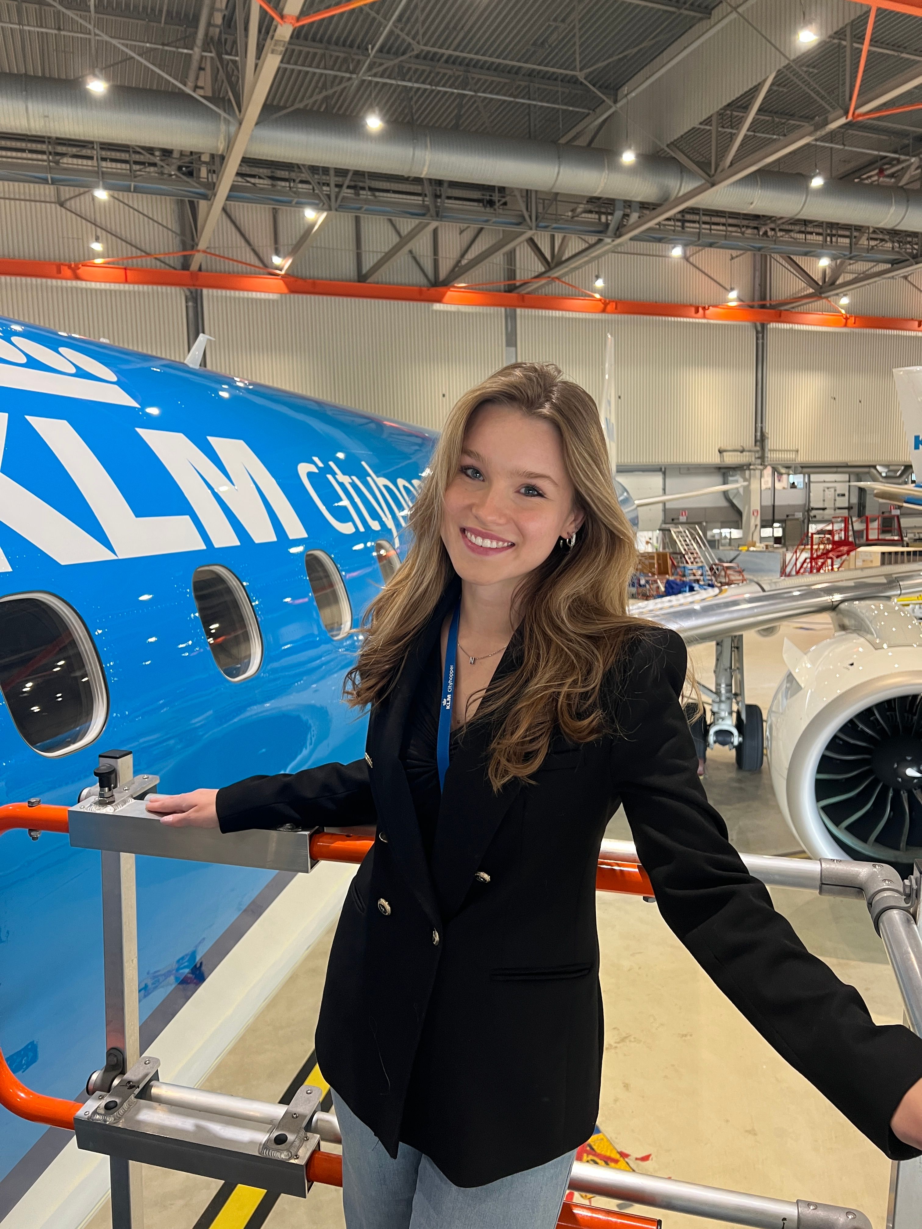 Nika KLM Cityhopper intern posing infront of a KLM Cityhopper airplane