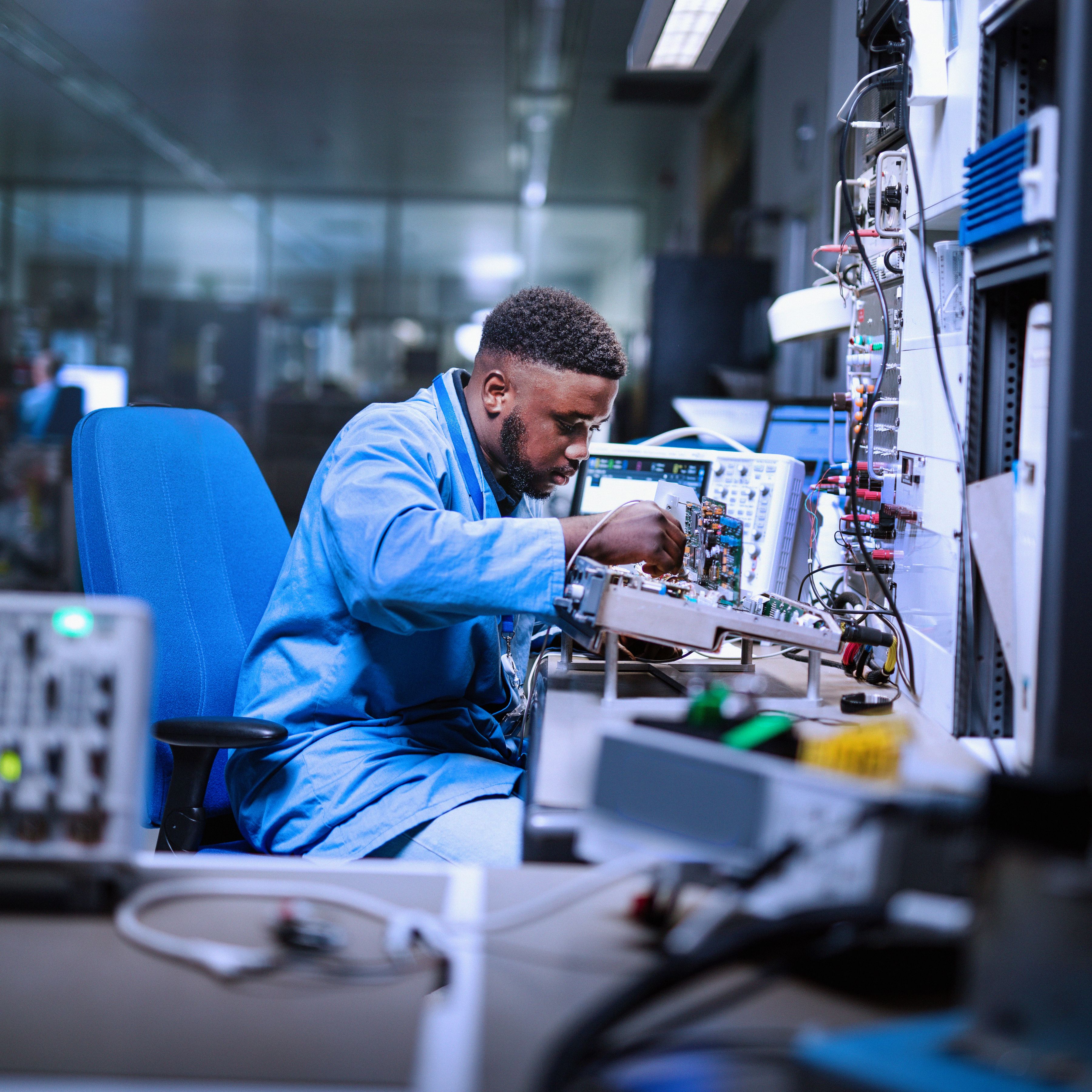 Engineering & Maintenance colleague working on aviation electronics