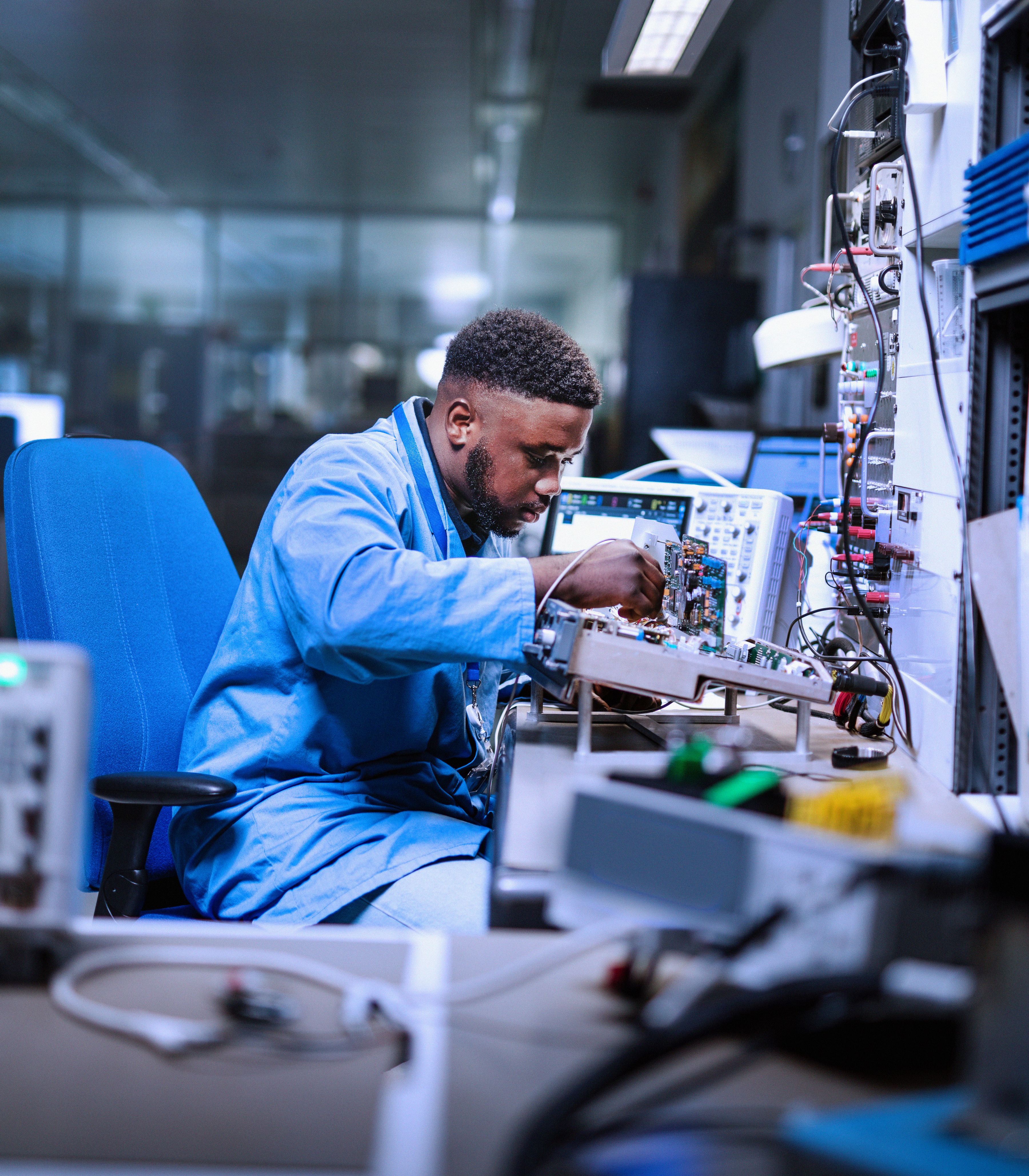 Engineering & Maintenance colleague working on aviation electronics