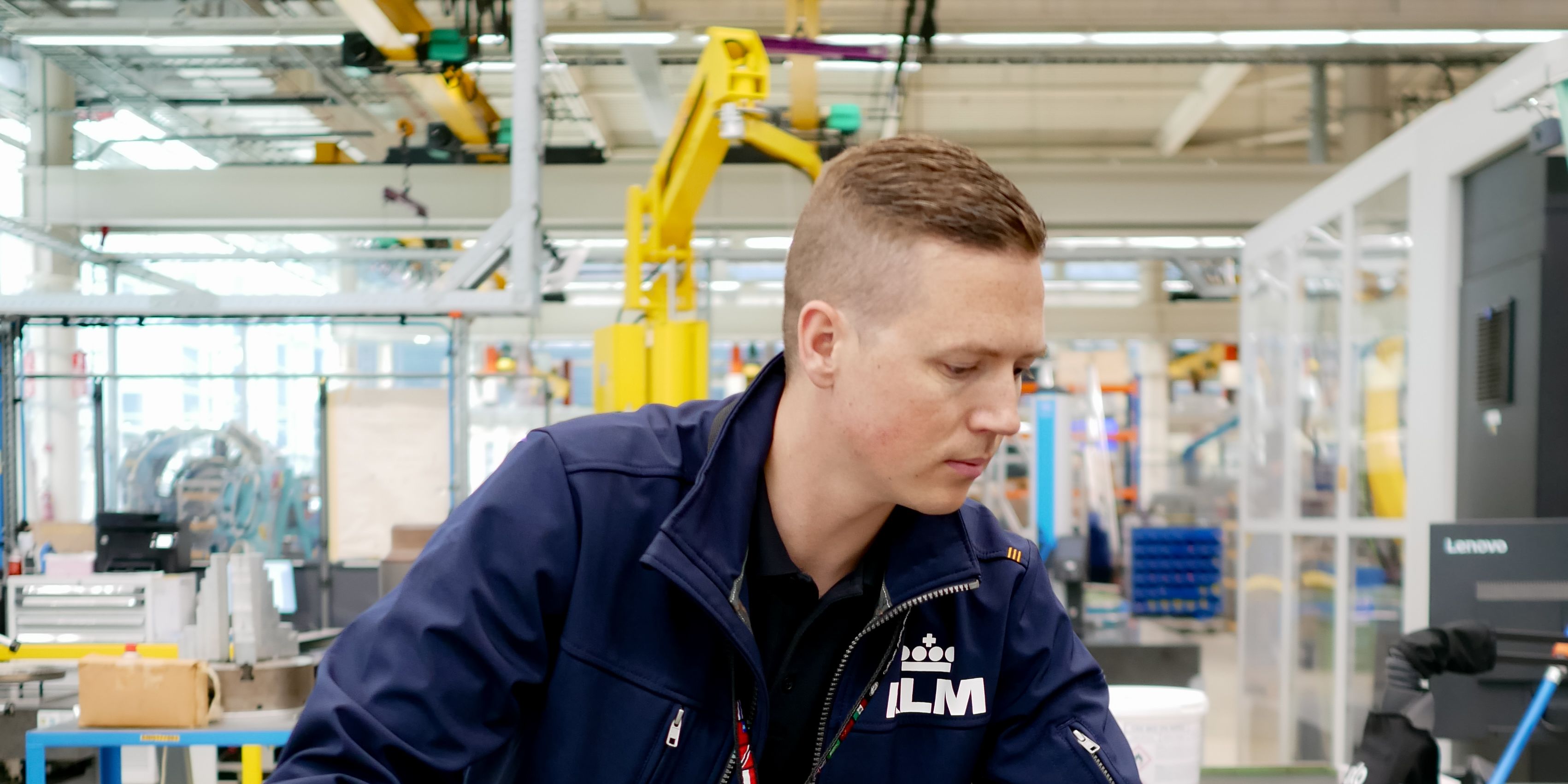 KLM colleague working on an aircraft component