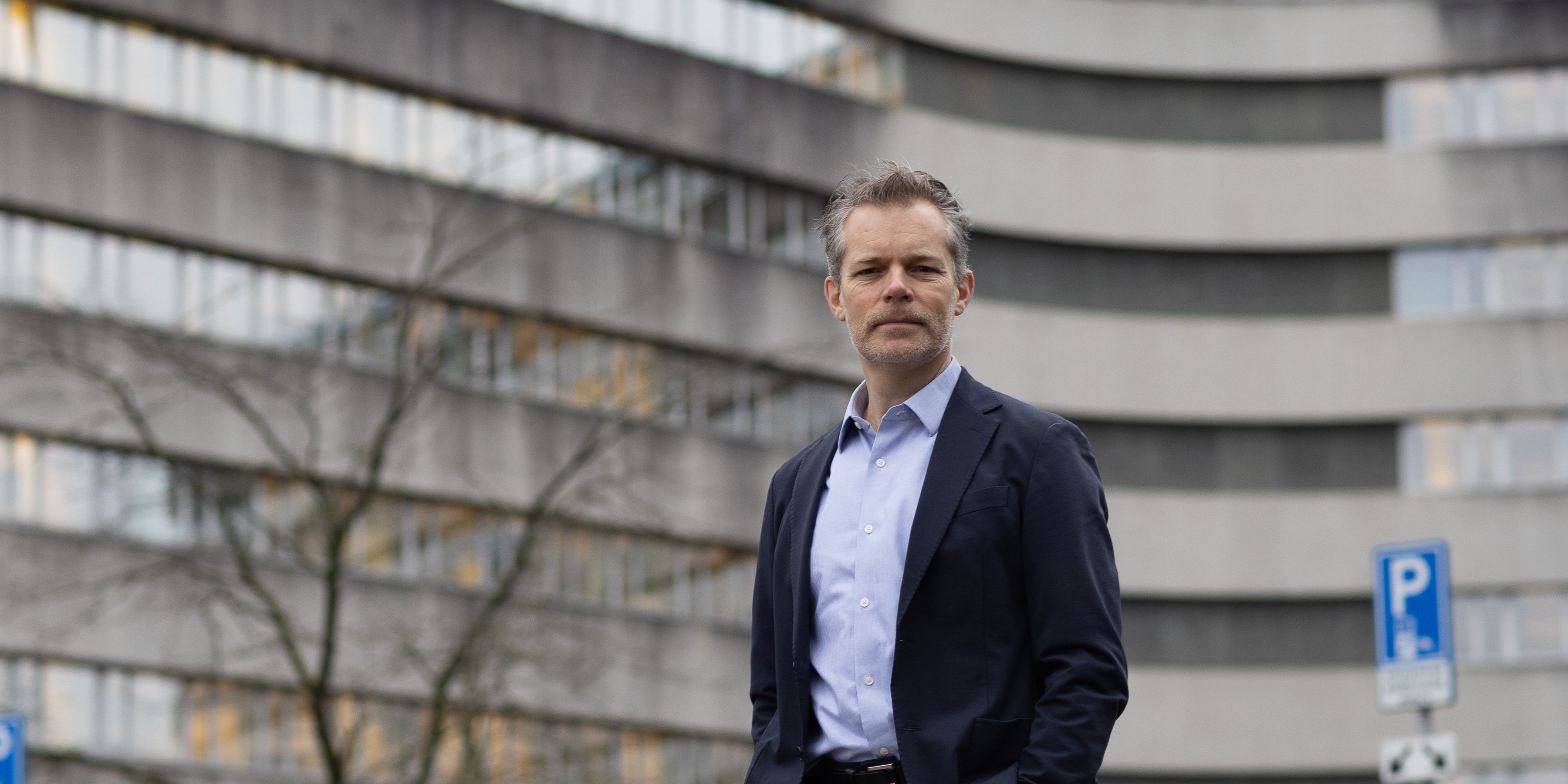 KLM colleague Ronald in front of the KLM headquarters
