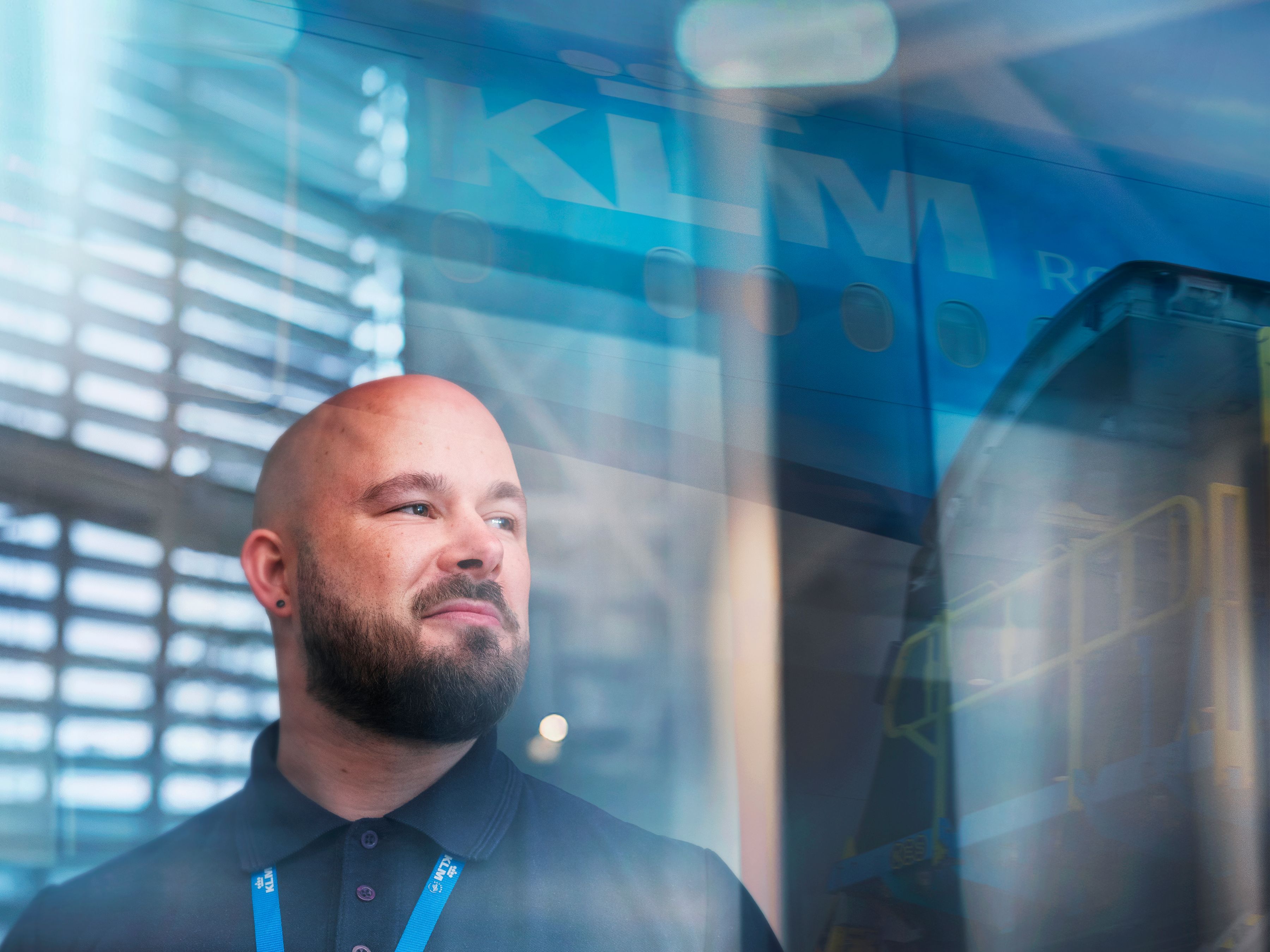 KLM ground staff colleague lookin out of a window