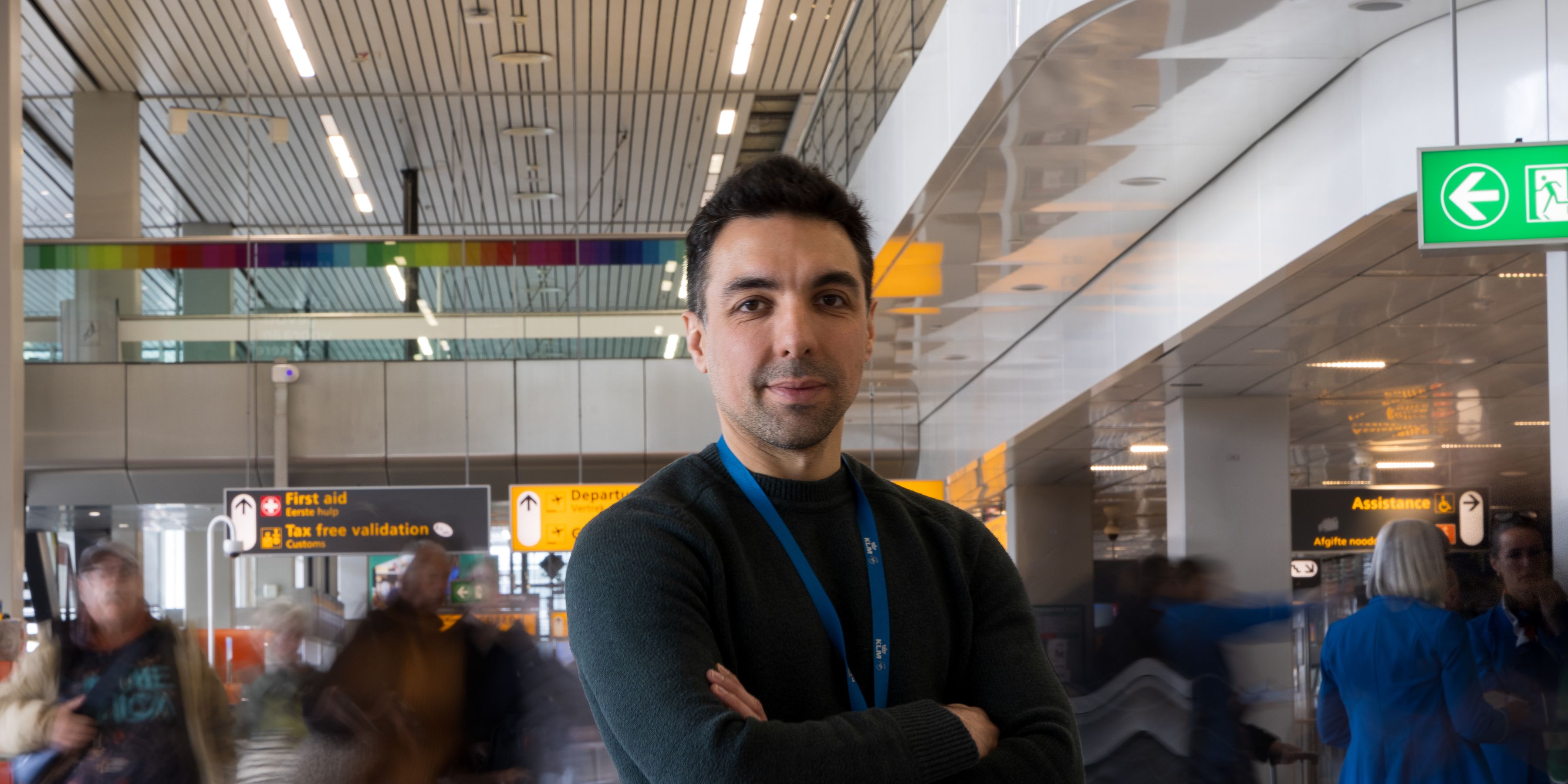 Man posing in the departure hall at Schiphol airport