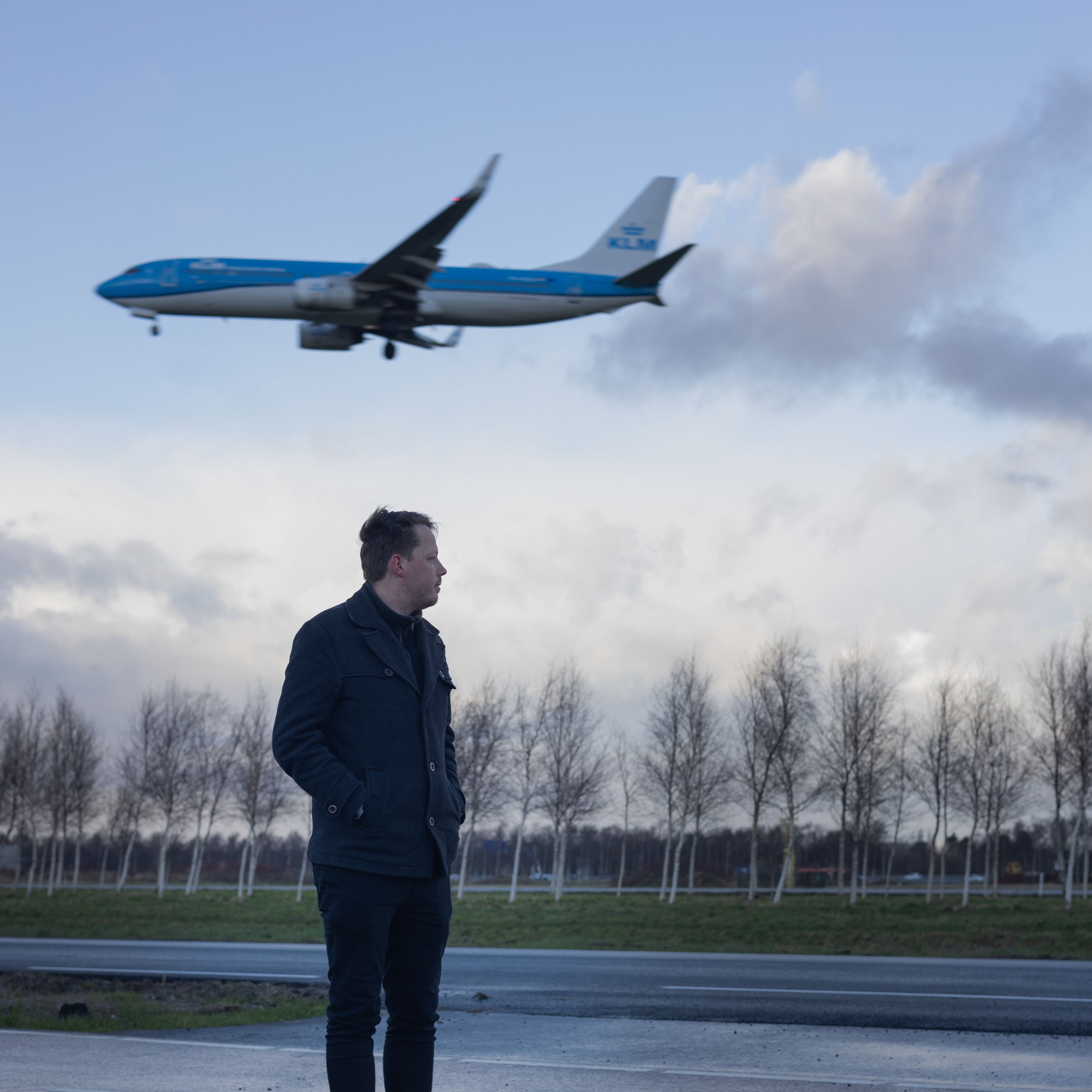 KLM colleague watching a plane land