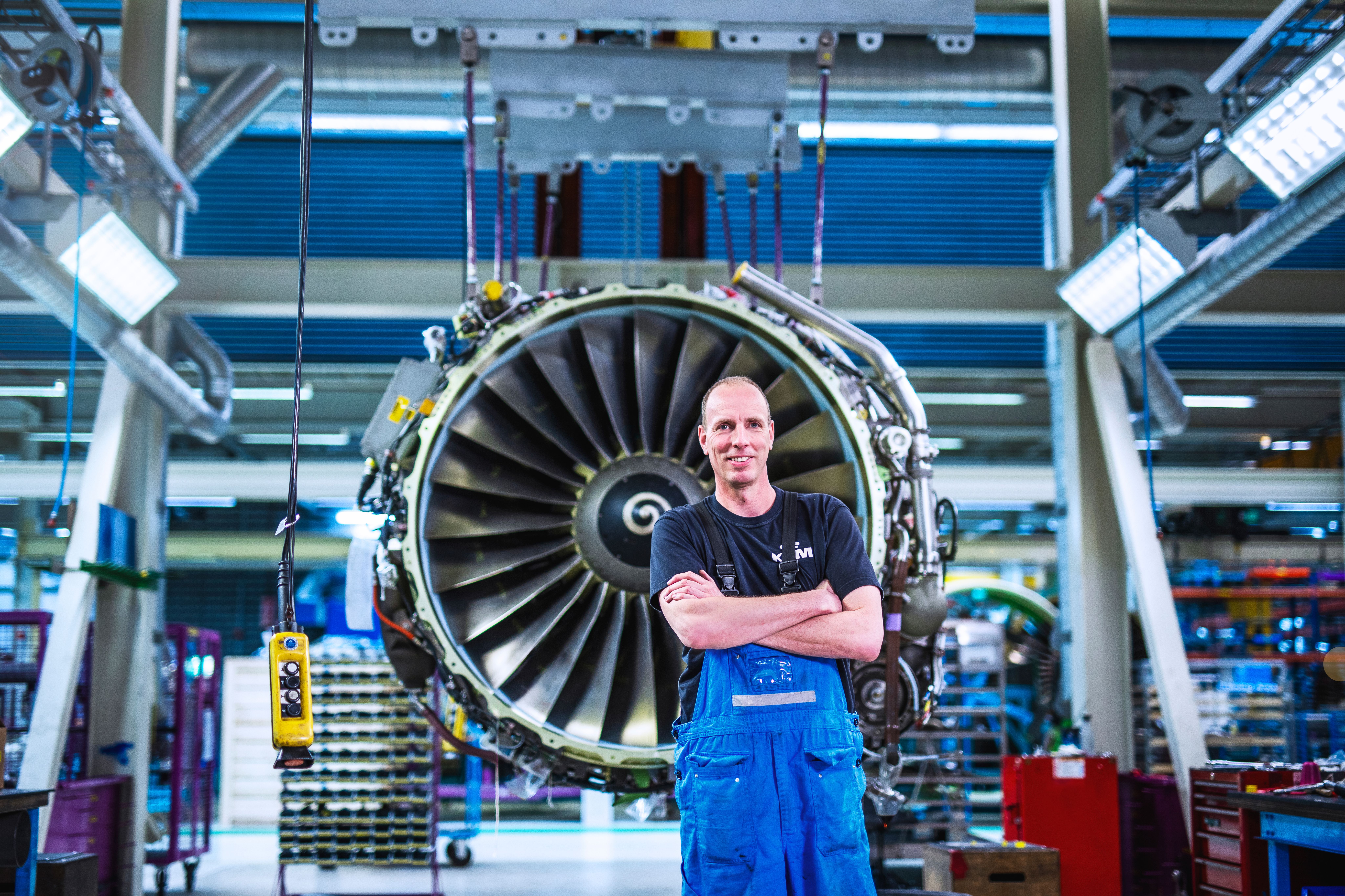 Engine mechanic in front of an engine