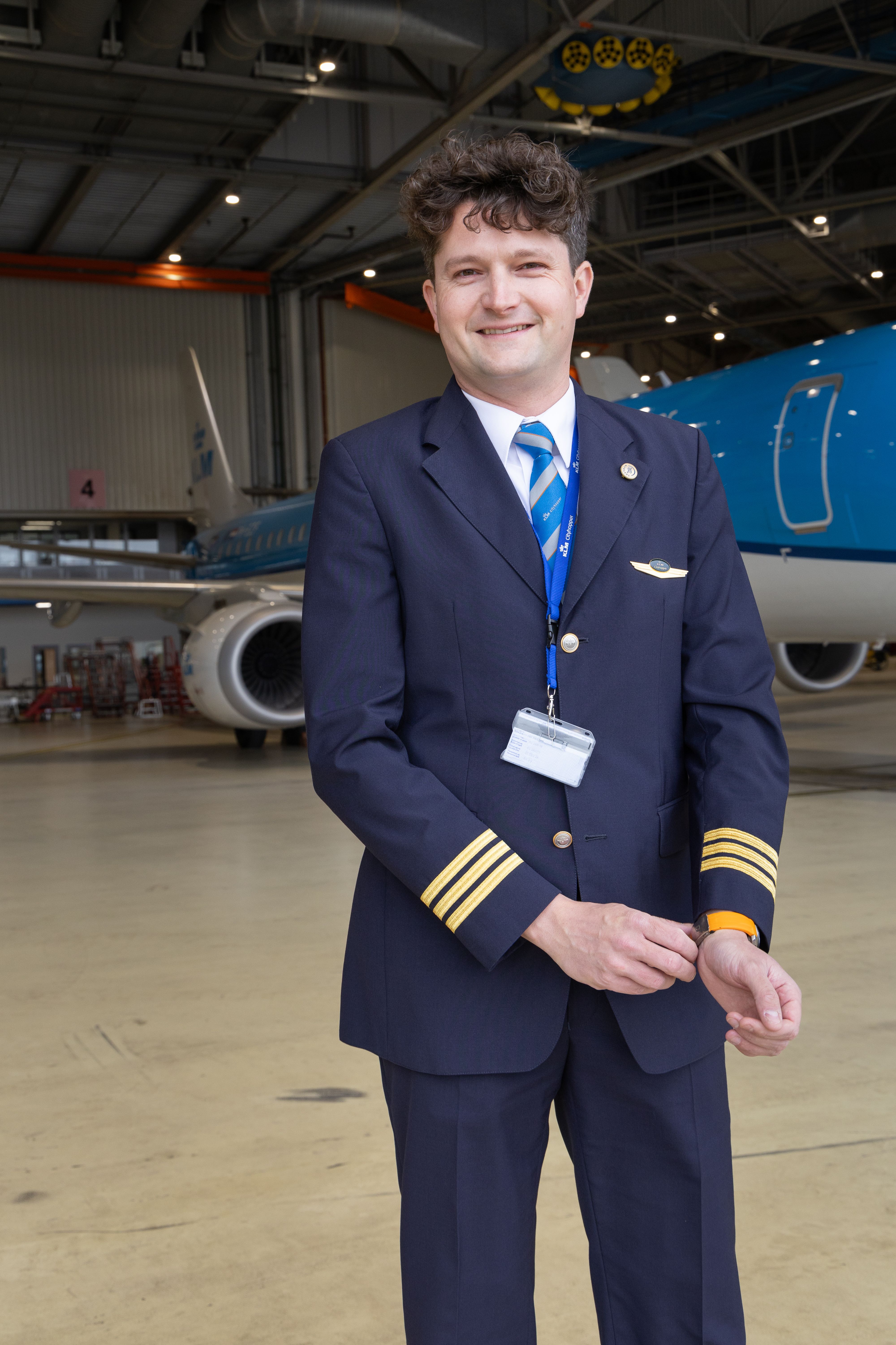 KLM Cityhopper pilot posing in a hanger