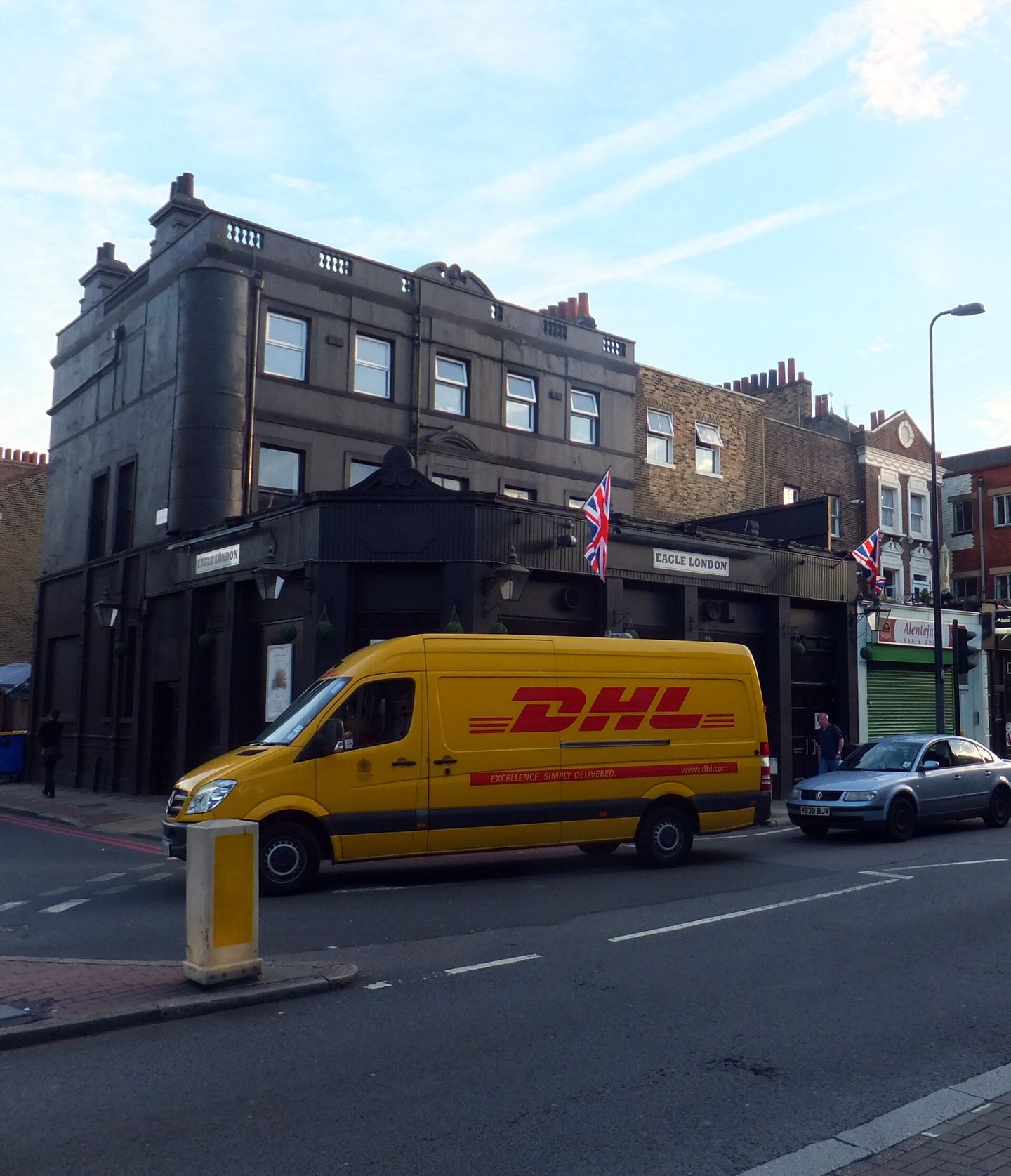 Eagle London on Kennington Lane, with a delivery van passing the front
