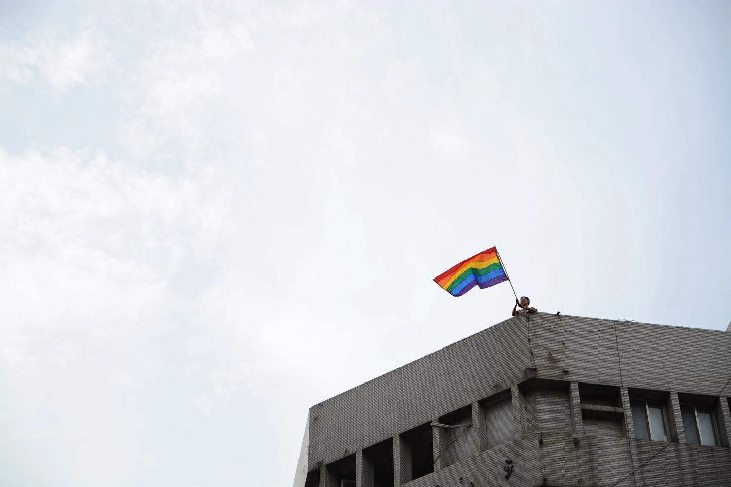 Marchers carrying rainbow flags at Taiwan LGBT Pride in Taipei