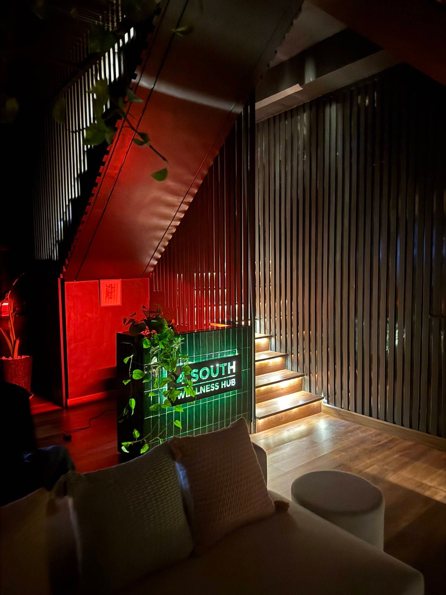 Entrance lounge and illuminated 4 South Wellness Hub sign in Quezon City