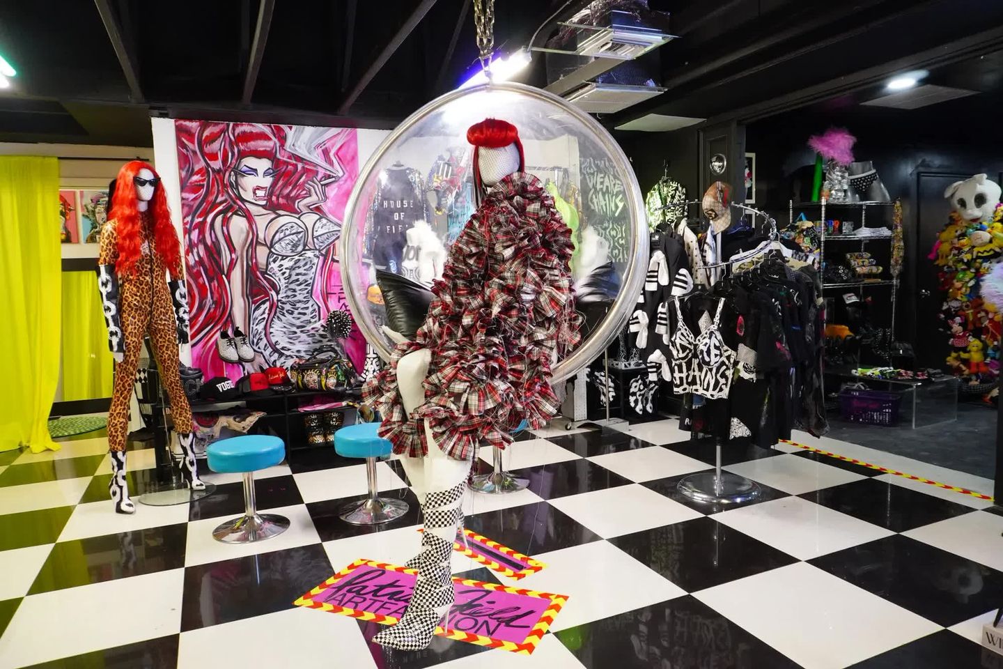 SUPERNATURAL haus studio boutique interior with hanging dress and checkered floor