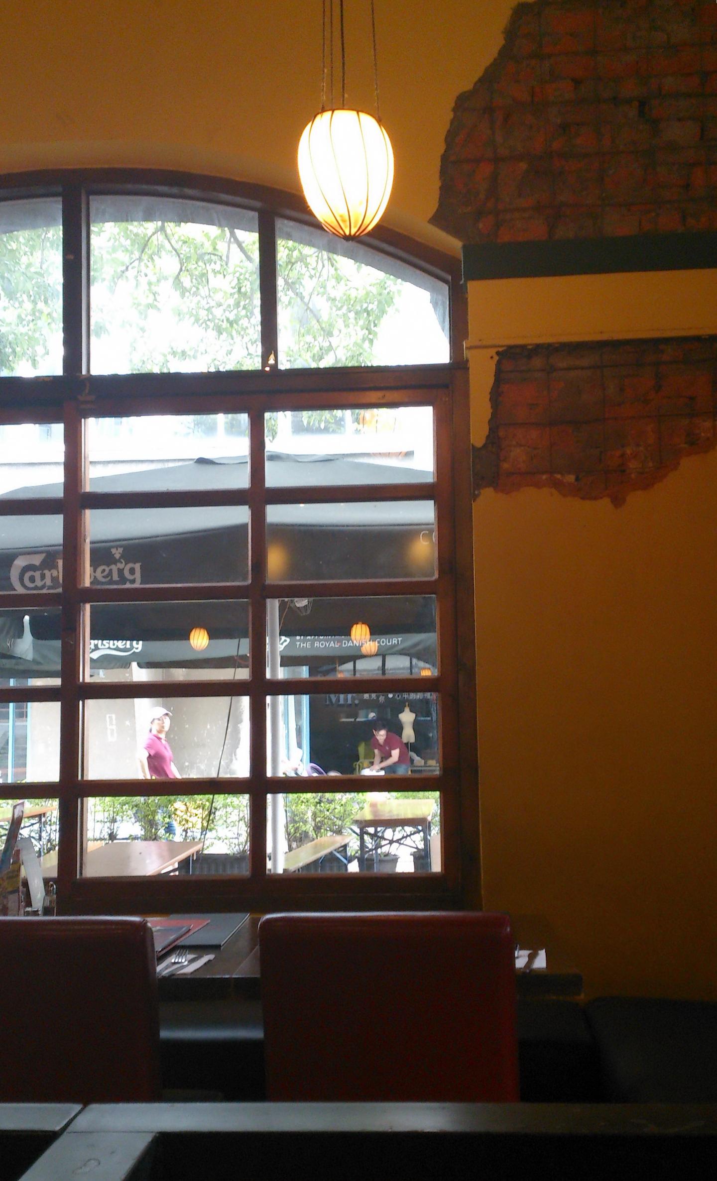 A brick building and outdoor tables at Huashan 1914 Creative Park
