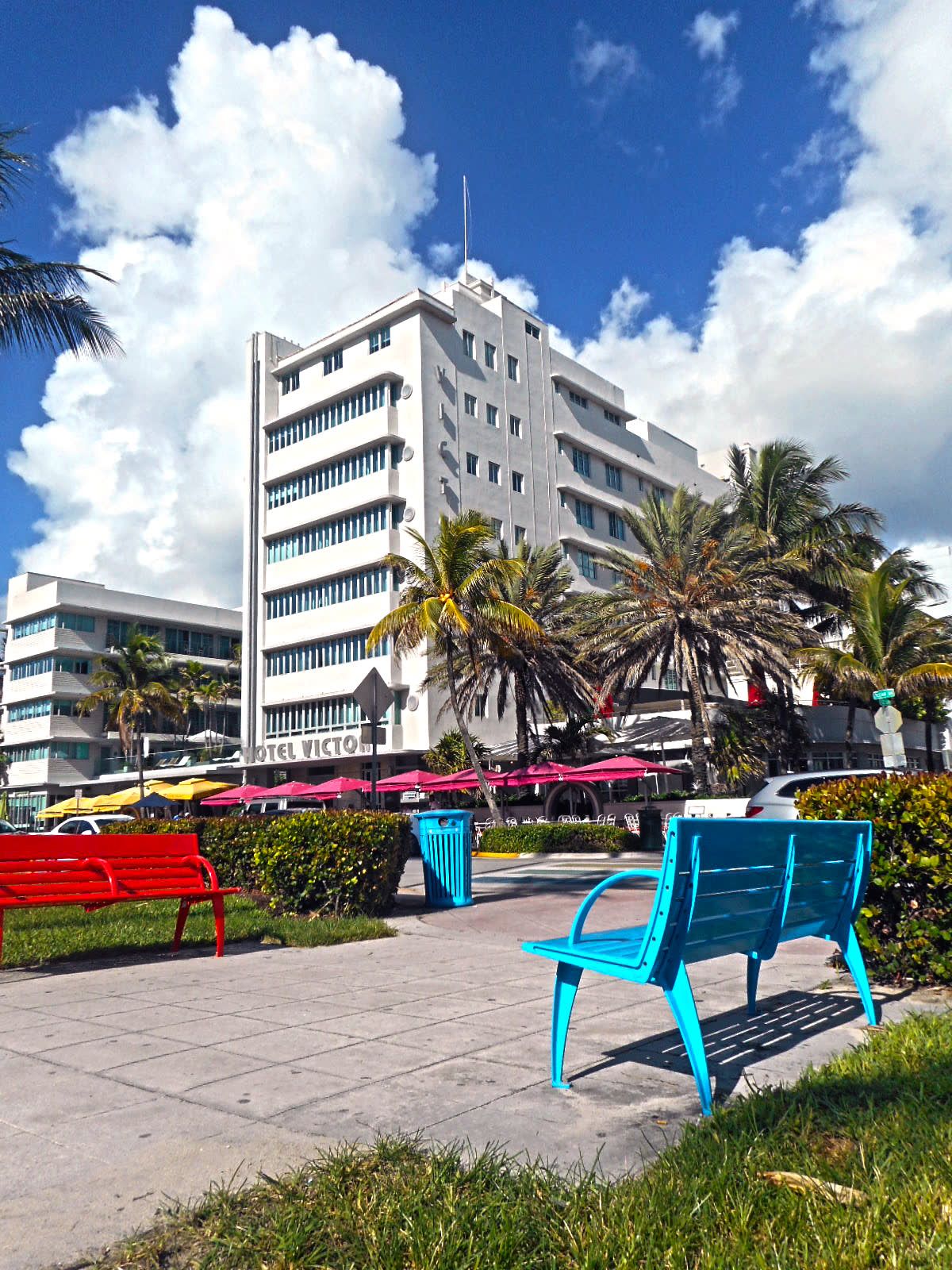 Lummus Park benches with Hotel Victor behind them on Ocean Drive