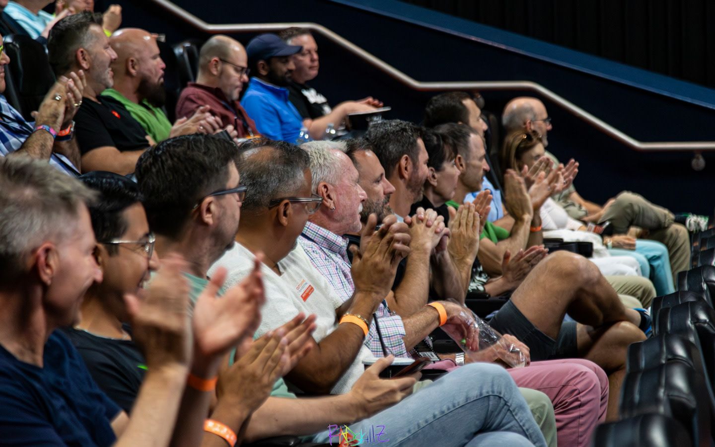 Cinema audience seated and clapping at an OUTshine LGBTQ+ Film Festival screening