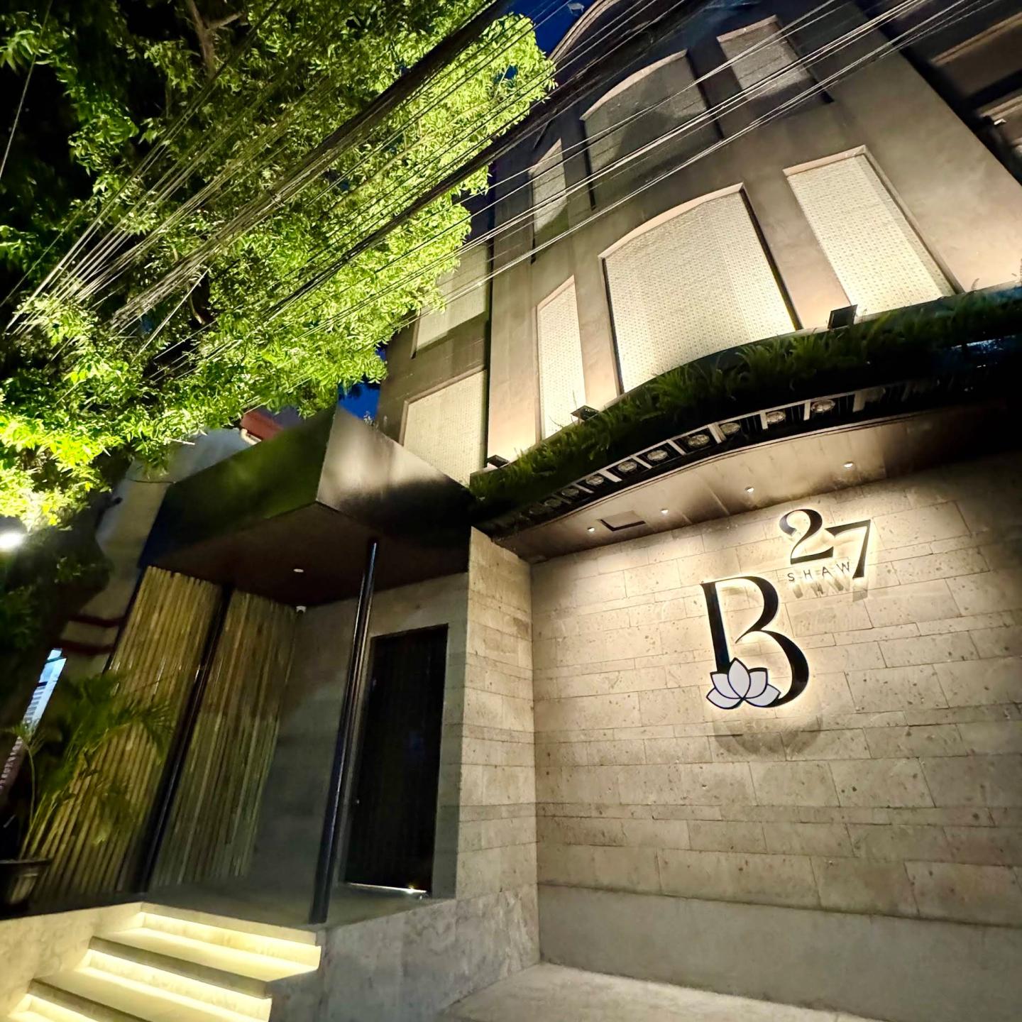 Night exterior and B by 27Shaw venue sign in Makati