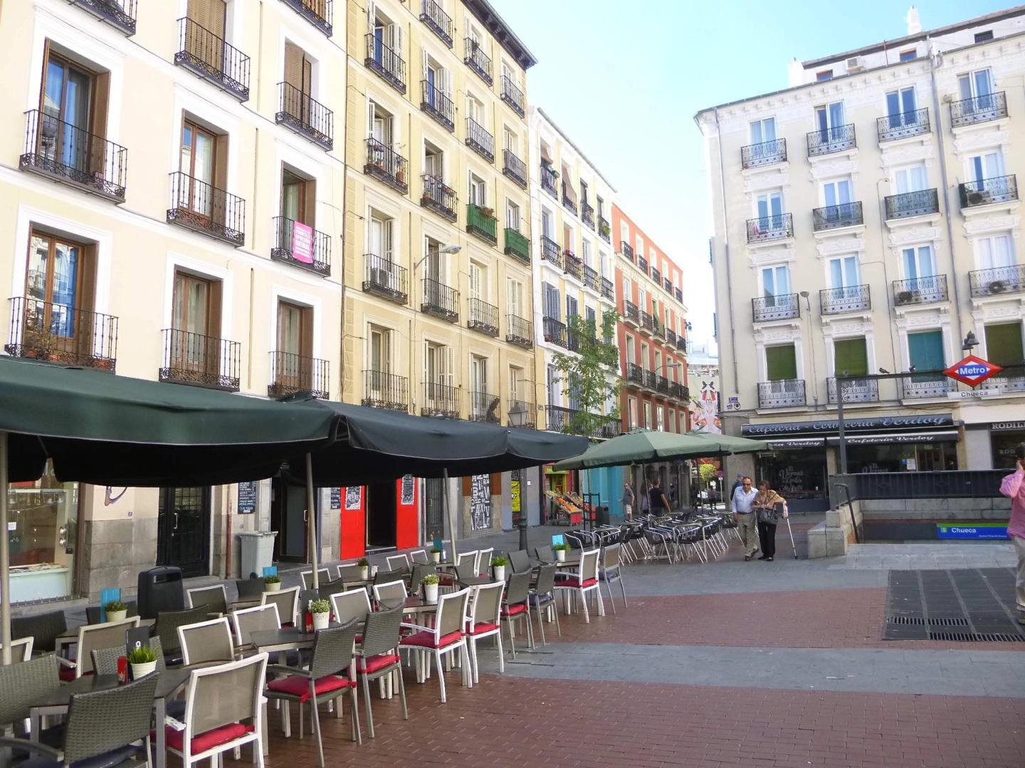 Plaza de Chueca with café tables and the Metro Chueca entrance