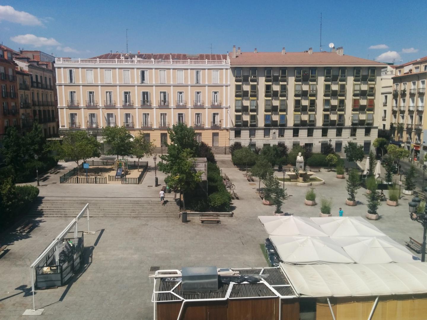Plaza de Pedro Zerolo seen from above, with the fountain and surrounding buildings