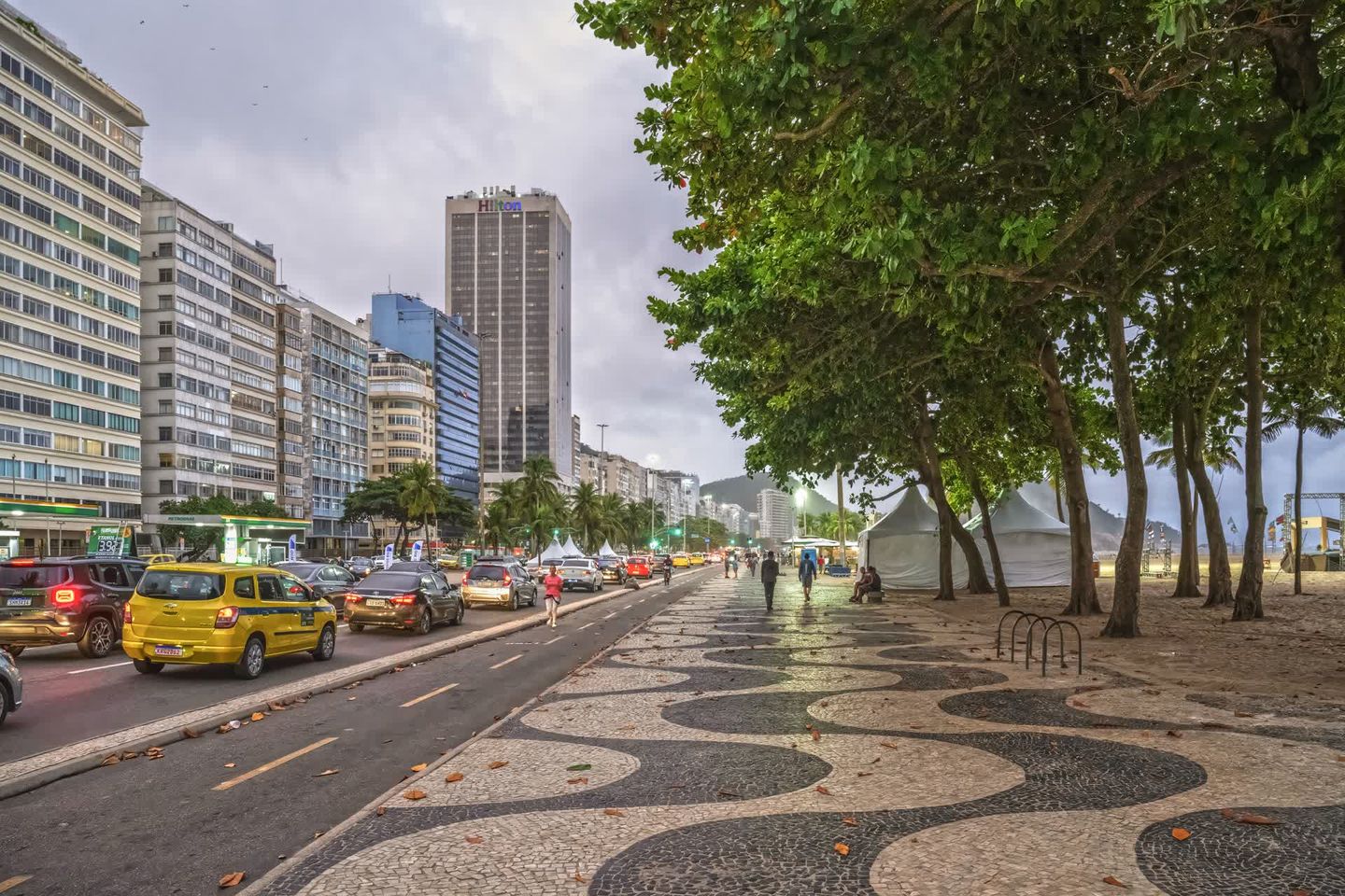 The Copacabana calçadão and Avenida Atlântica, with the Portuguese wave pavement and the Hilton tower