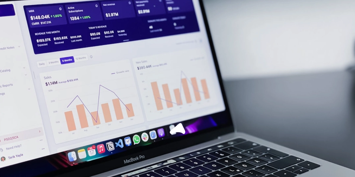 computer macbook with analytics dashboard