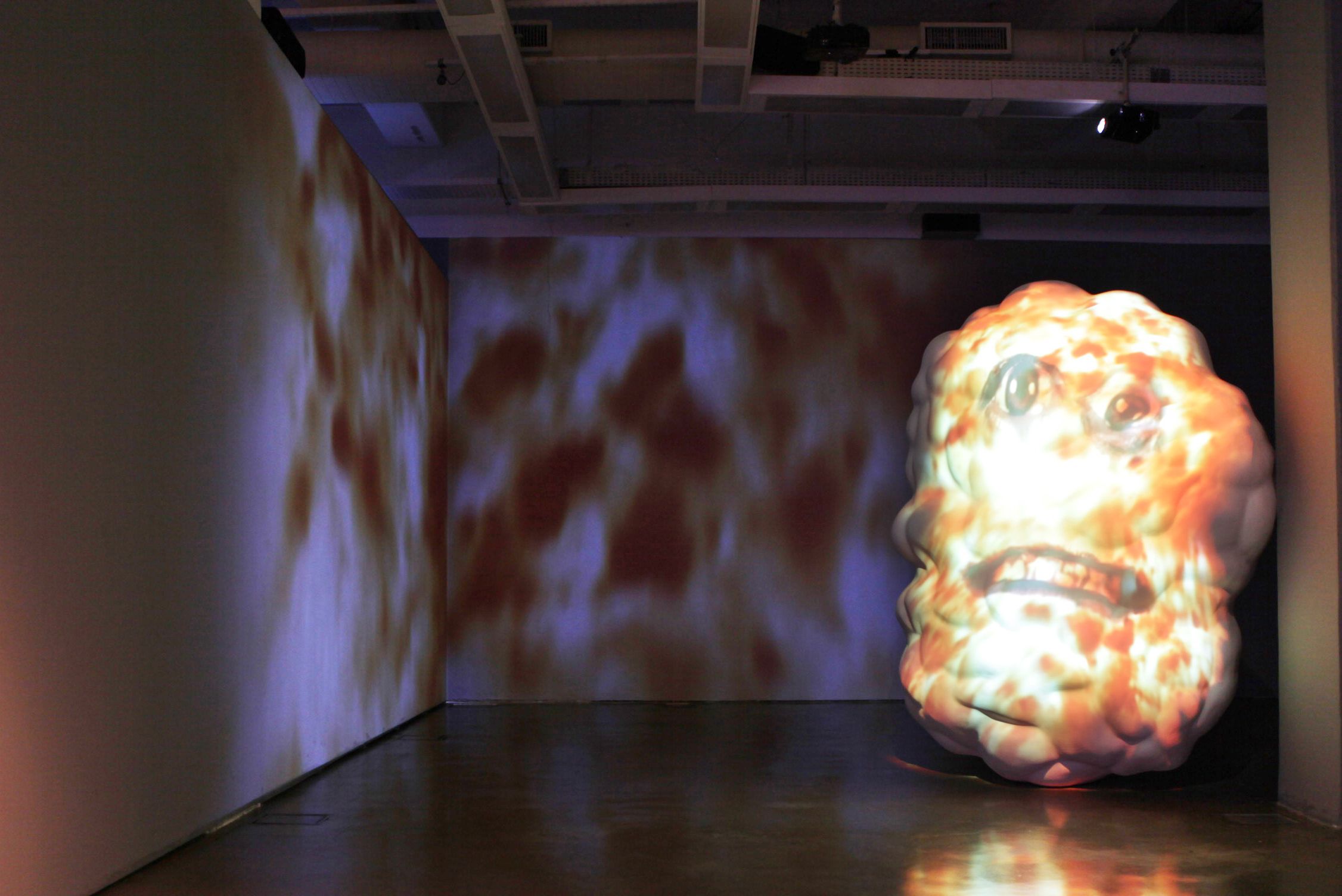 Sculpture and video panel by Tony Oursler