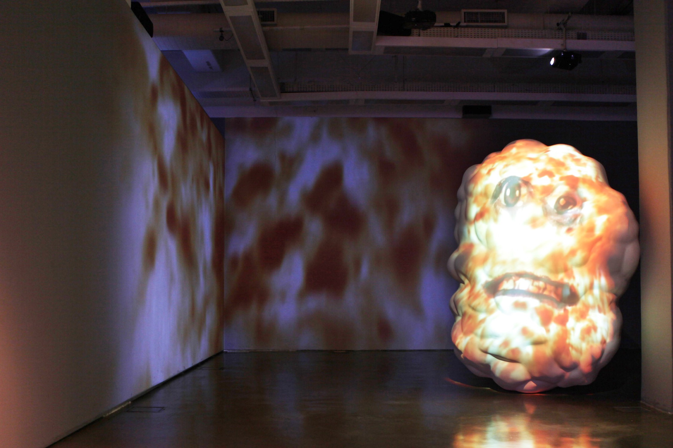 Sculpture and video panel by Tony Oursler