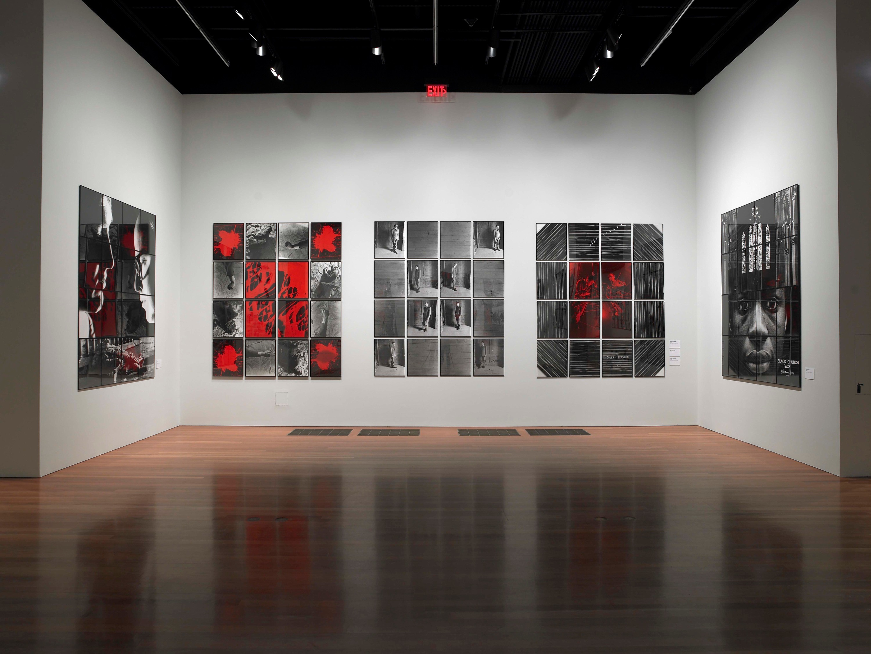 Installation view of Gilbert & George: Major Exhibition at de Young Fine Arts Museum