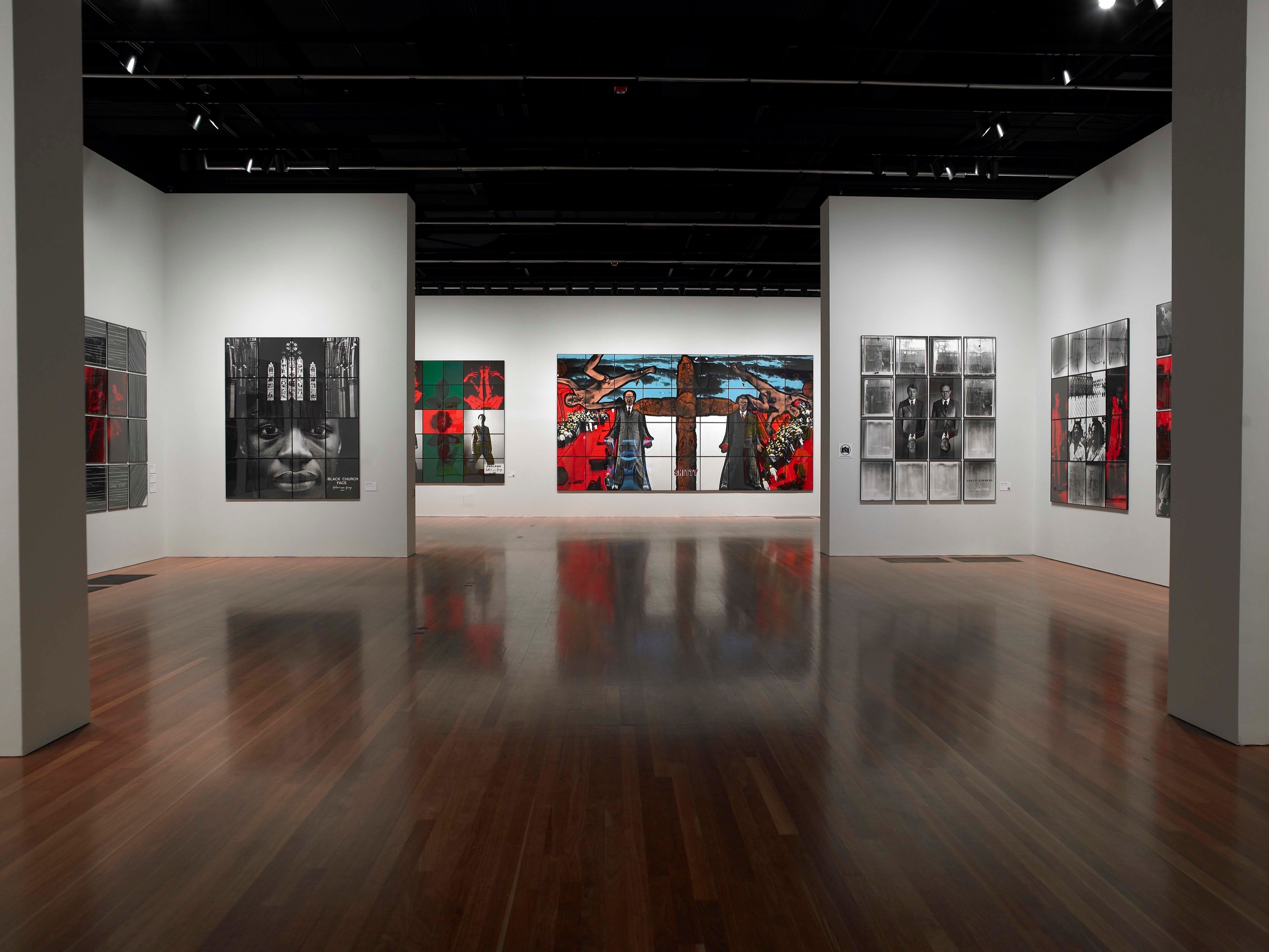 Installation view of Gilbert & George: Major Exhibition at de Young Fine Arts Museum