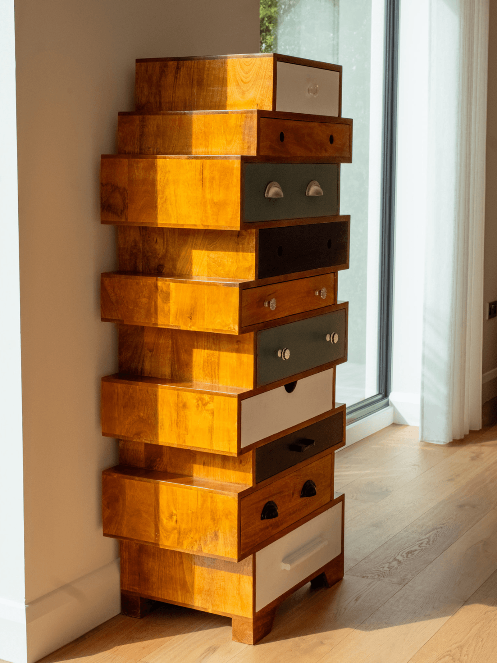 Sevenoaks interior design featuring a sculptural stacked wooden drawer cabinet in a contemporary living space