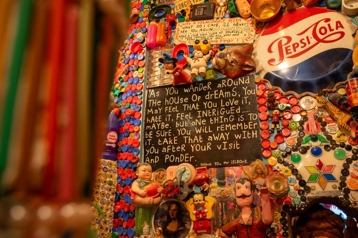 Mosaics, text and found objects inside Stephen Wright's House of Dreams Museum.