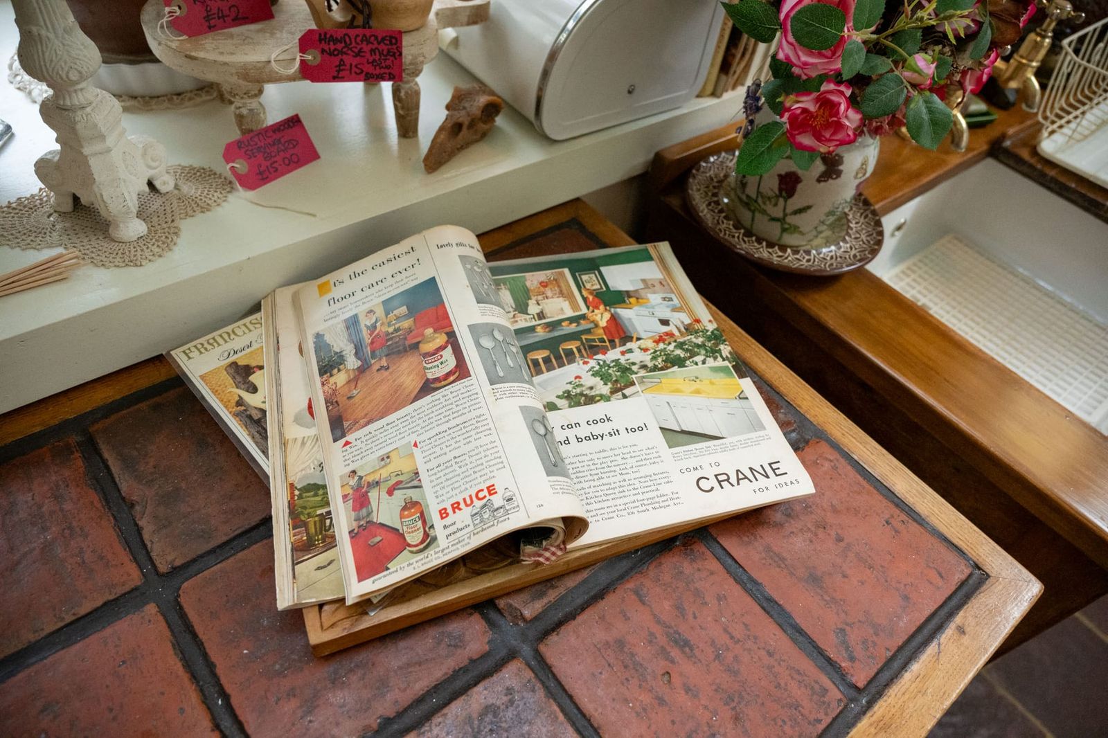 An open travel journal on the table at Talliston House and Gardens.