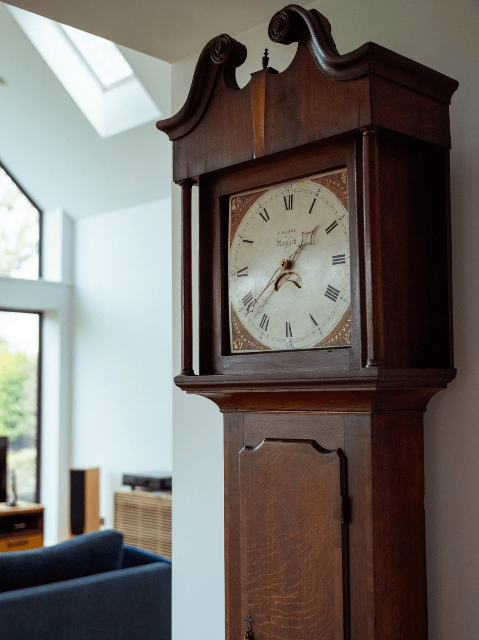 Kent home interiors featuring an antique longcase grandfather clock in a contemporary living space