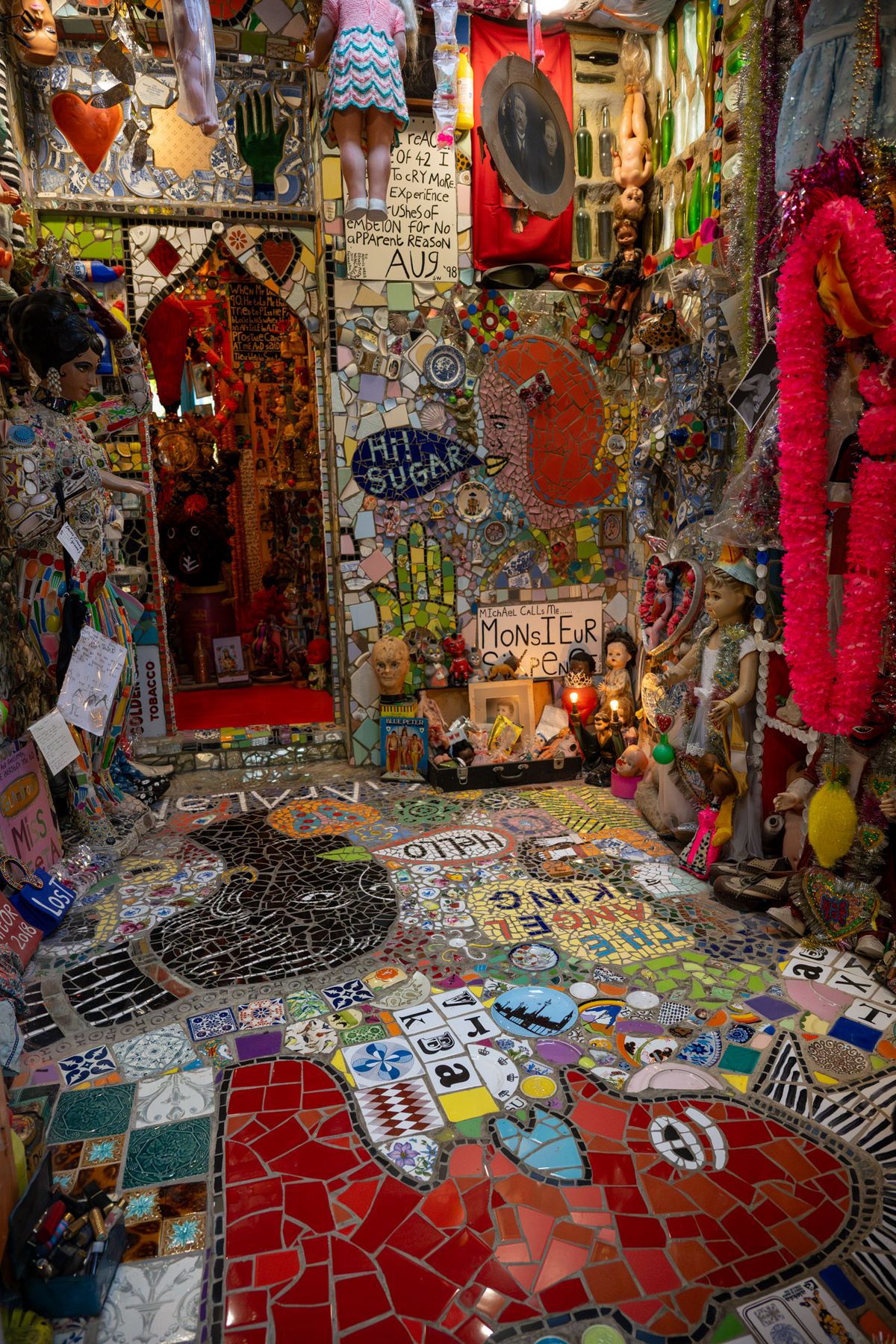 Mosaics, text and found objects inside Stephen Wright's House of Dreams Museum.