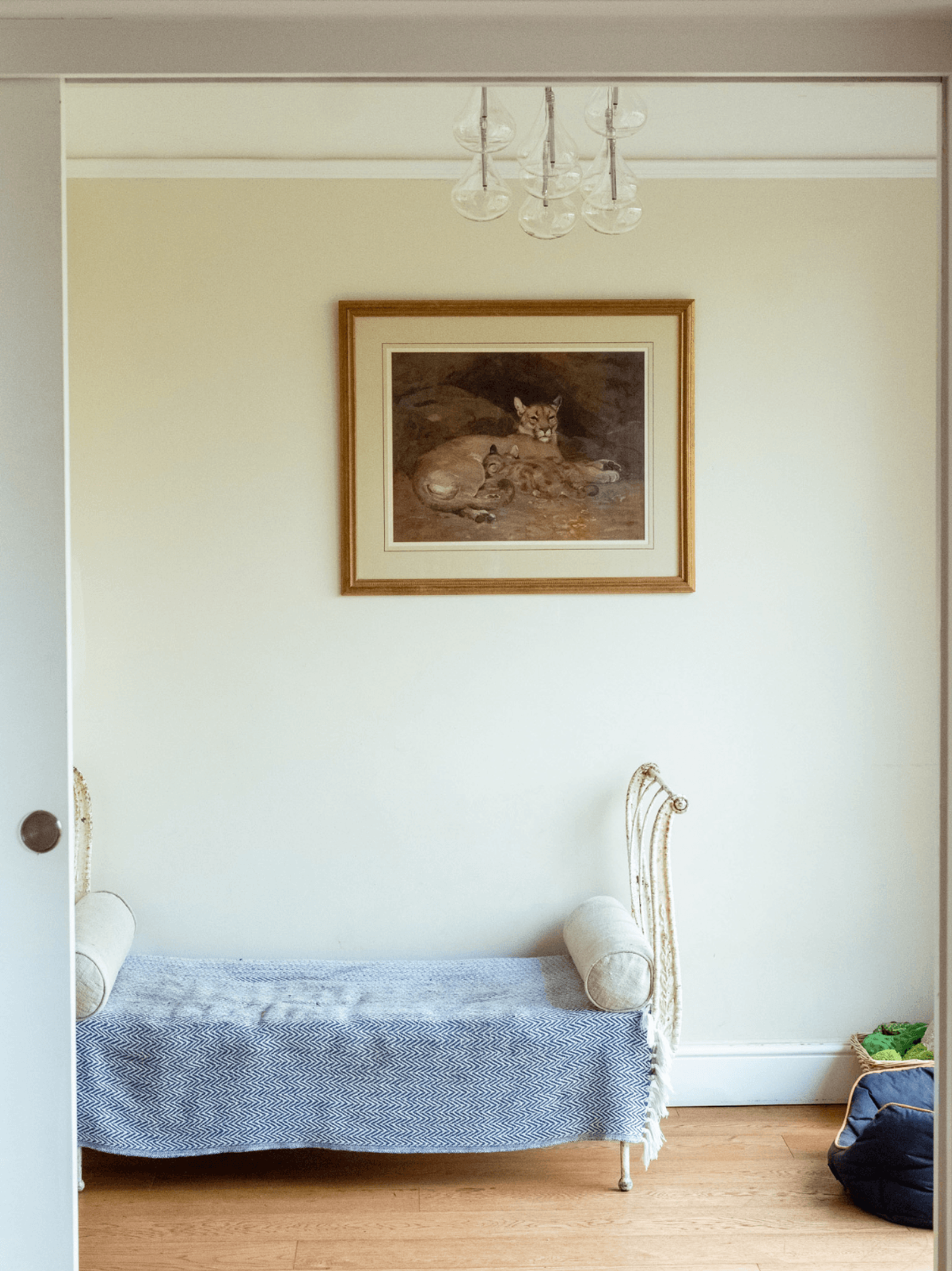 Kent home interiors bedroom with upholstered daybed, soft textiles and framed artwork