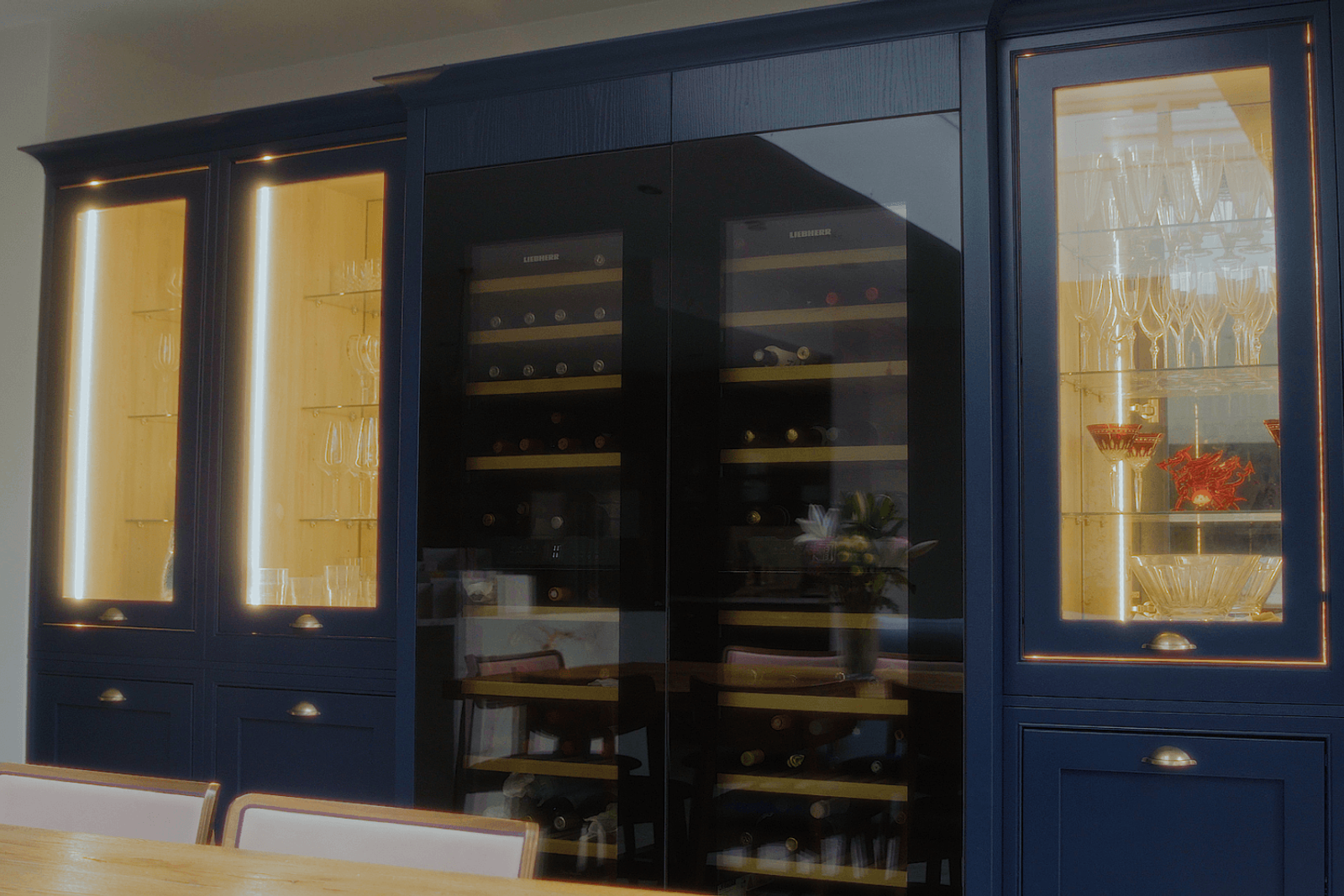 Beckenham home interiors bespoke cabinetry with wine storage and illuminated glass display