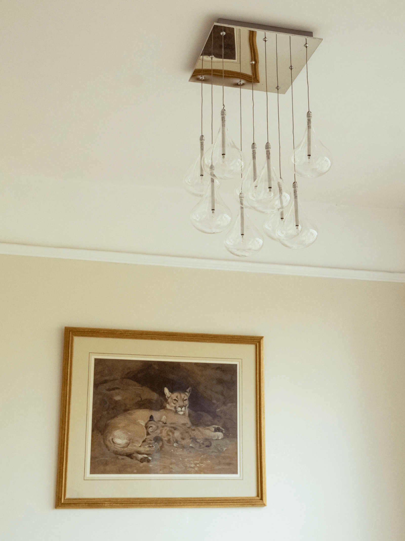 Kent home interiors contemporary pendant lighting with glass shades above framed artwork