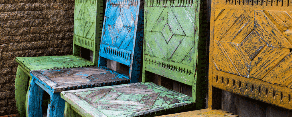 outdoor furniture green, blue and yellow rusted outdoor chairs