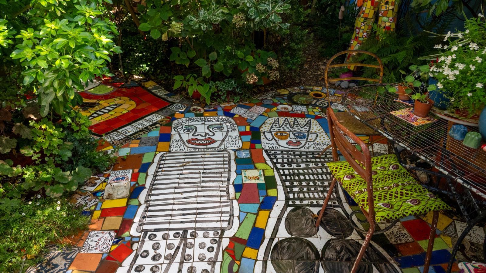 Mosaics, text and found objects inside Stephen Wright's House of Dreams Museum.