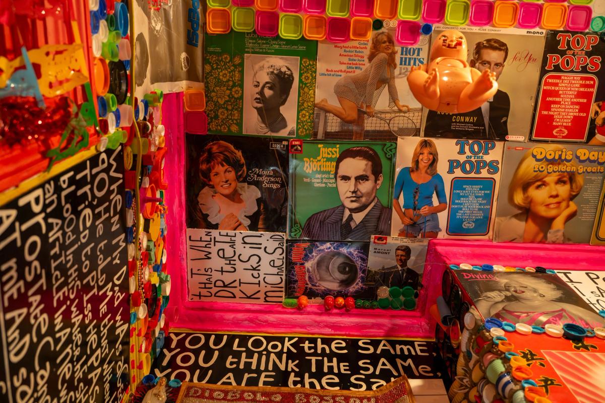 Mosaics, text and found objects inside Stephen Wright's House of Dreams Museum.